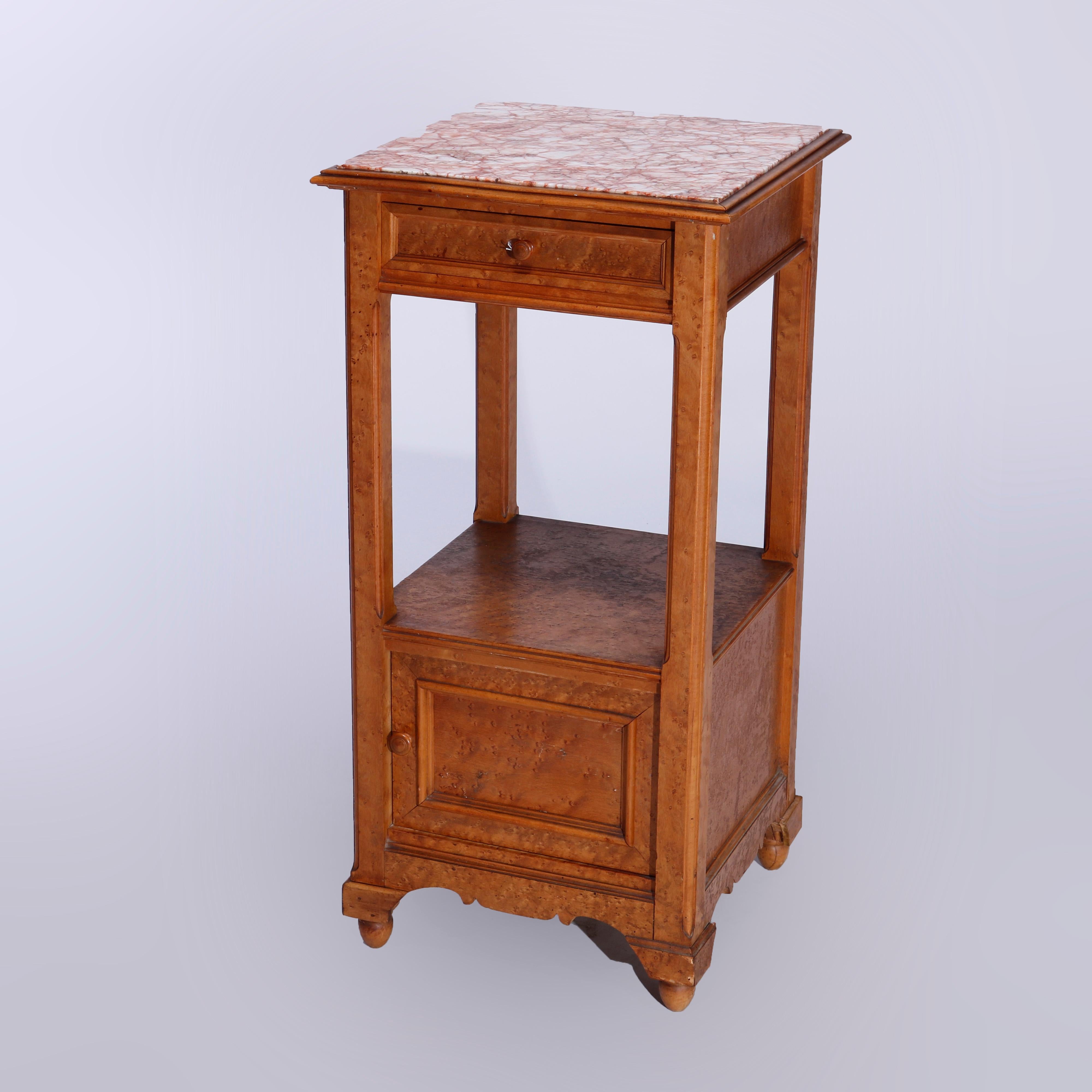 An antique French Renaissance side stand offers inset marble top surmounting birds eye maple frame with single upper drawer over lower shelf and single door cabinet, raised on stylized bracket feet, c1900

Measures - 33.5'' H x 16.5'' W x 16.5'' D.