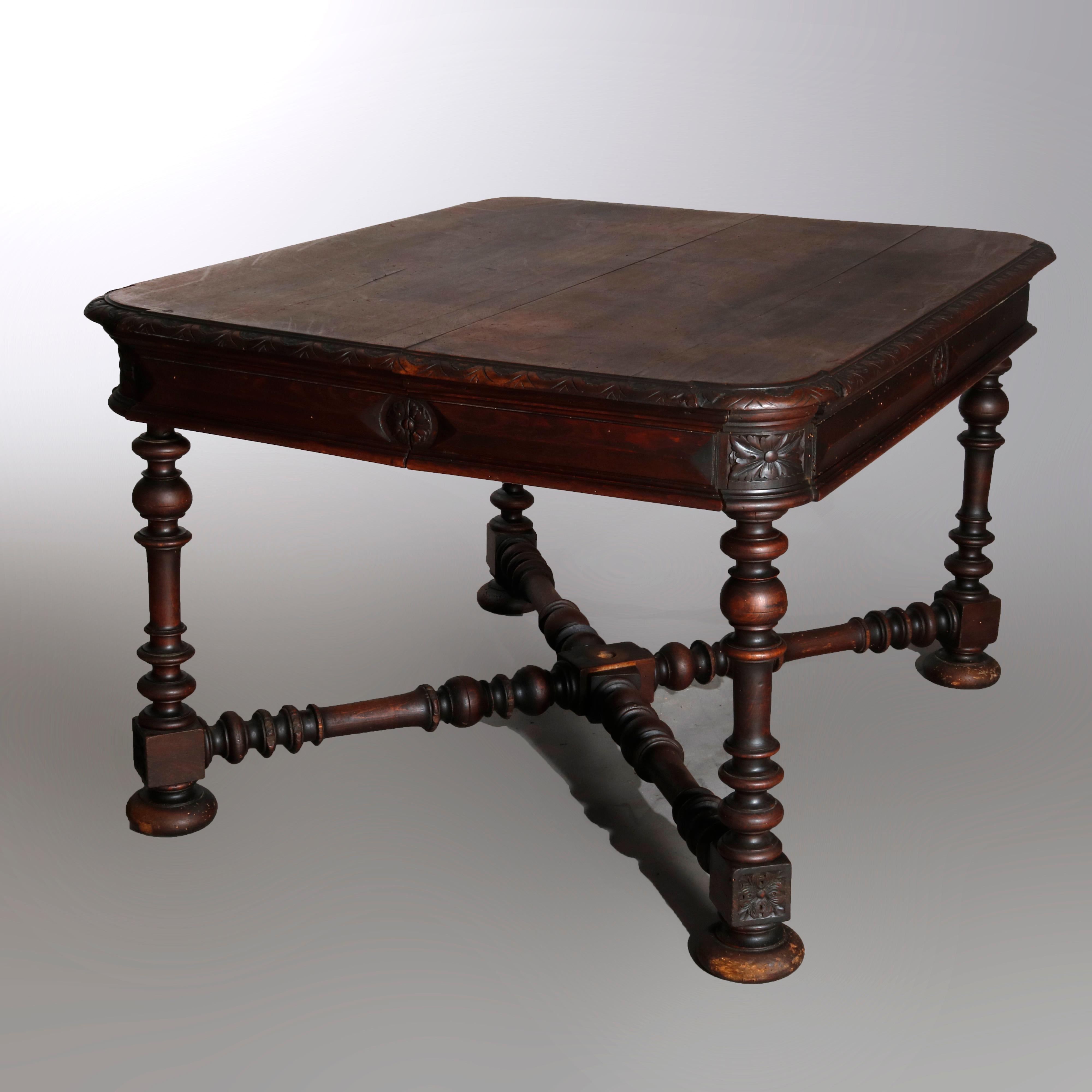 Antique French Renaissance carved walnut extension dining table with top having curved beveled bordering and pyramidal skirt with rosettes raised on turned balustrade legs with X-stretcher and bun feet, 19th century

Measures: 29