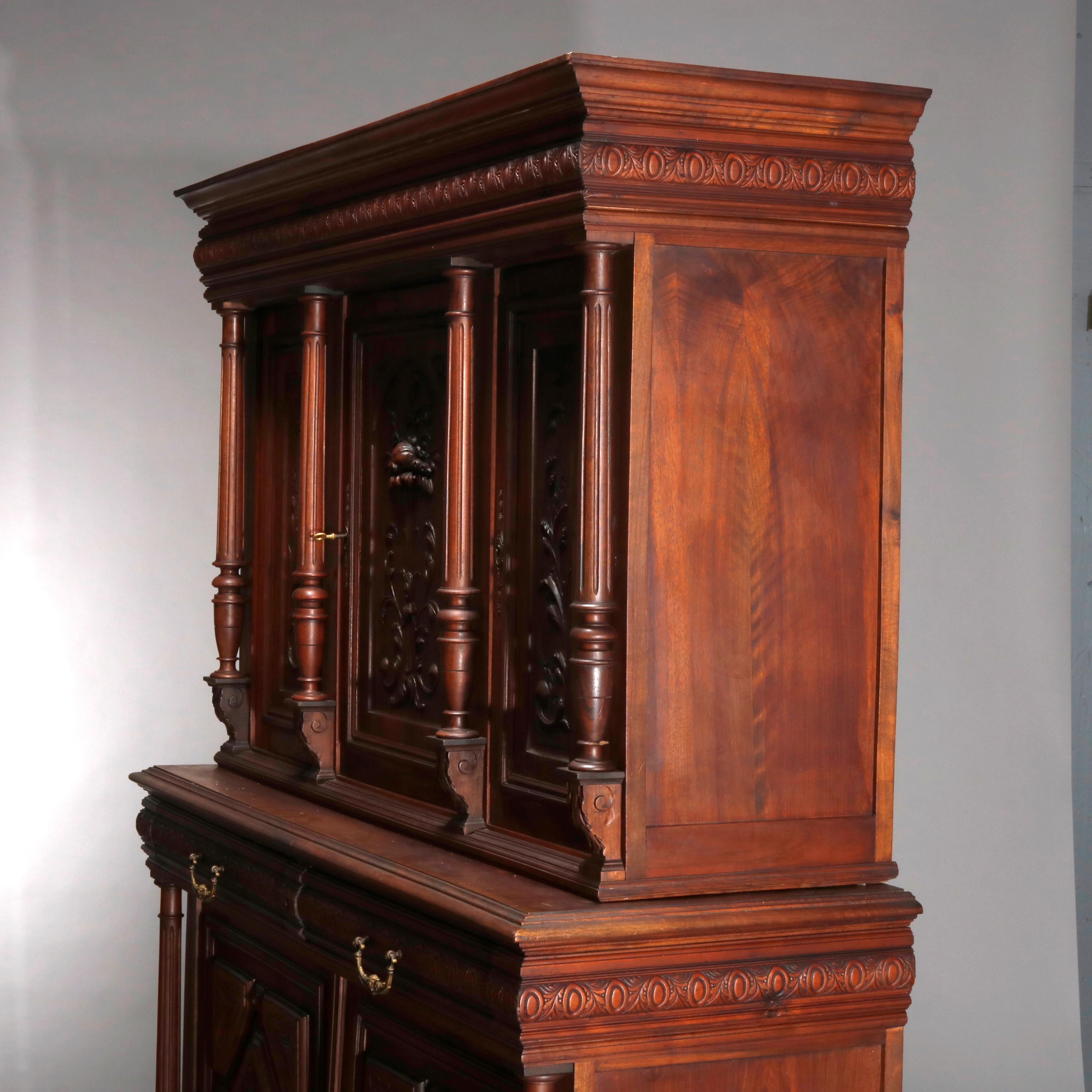 Antique French Renaissance deeply carved walnut cupboard with full columns, Panier de Fleurs and acanthus, raised on bun feet, 19th century

Measures: 75.25