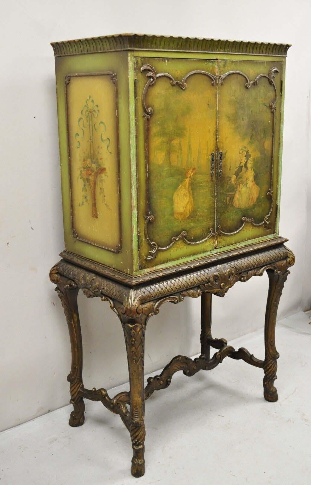 Antique French Renaissance/Baroque Green Distressed Hand Painted Radio/Bar Cabinet Cupboard. Item features a 2 part construction, carved baroque style legs, wonderful hand painted courting scene to front doors, floral painted sides, distressed