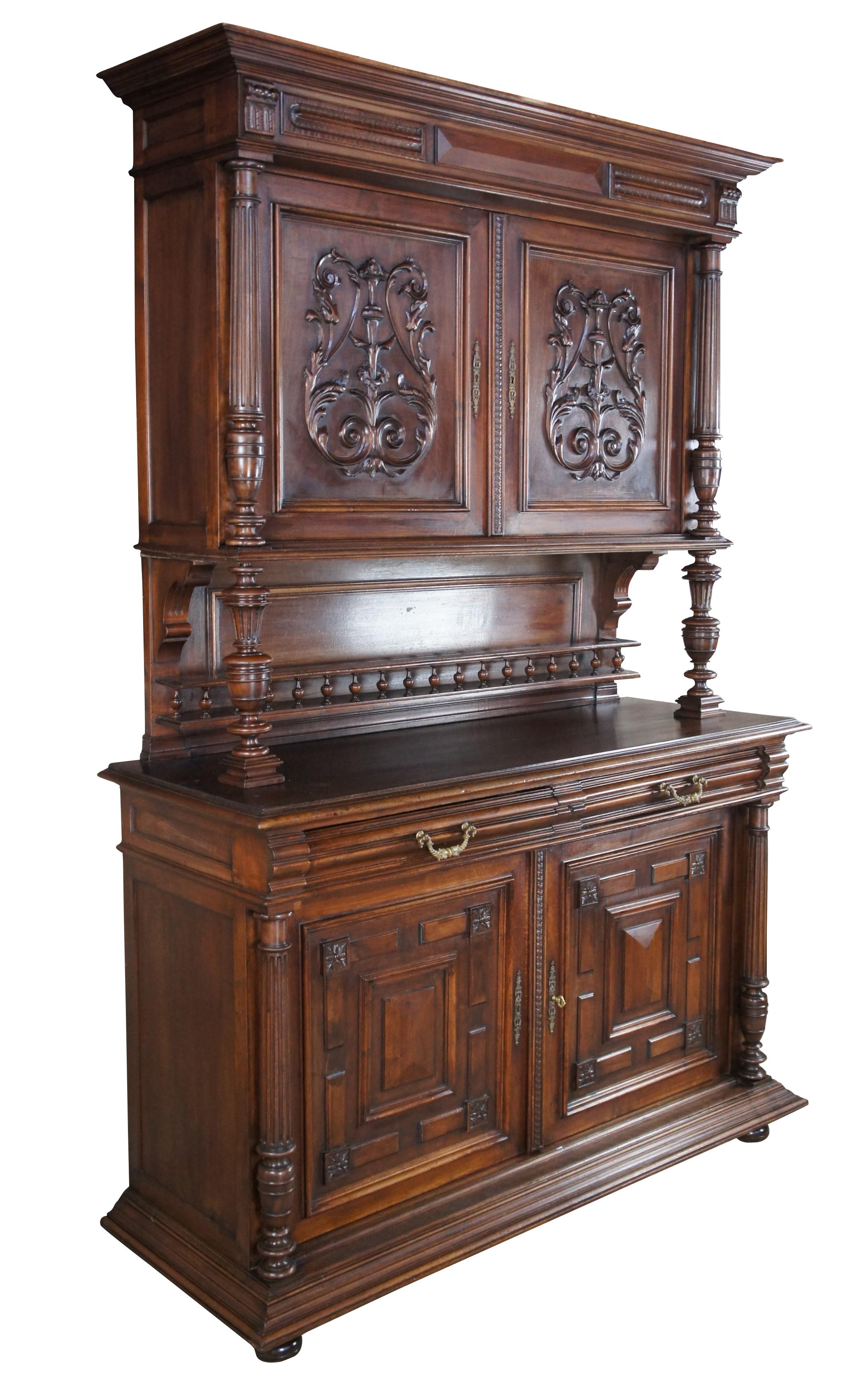 An impressive Renaissance Revival / Henry II style Buffet, bar back or server with hutch. A rectangular form made from walnut with two cabinets for storage, hand dovetailed drawers and a central serving area. Features hand turned fluted columns,