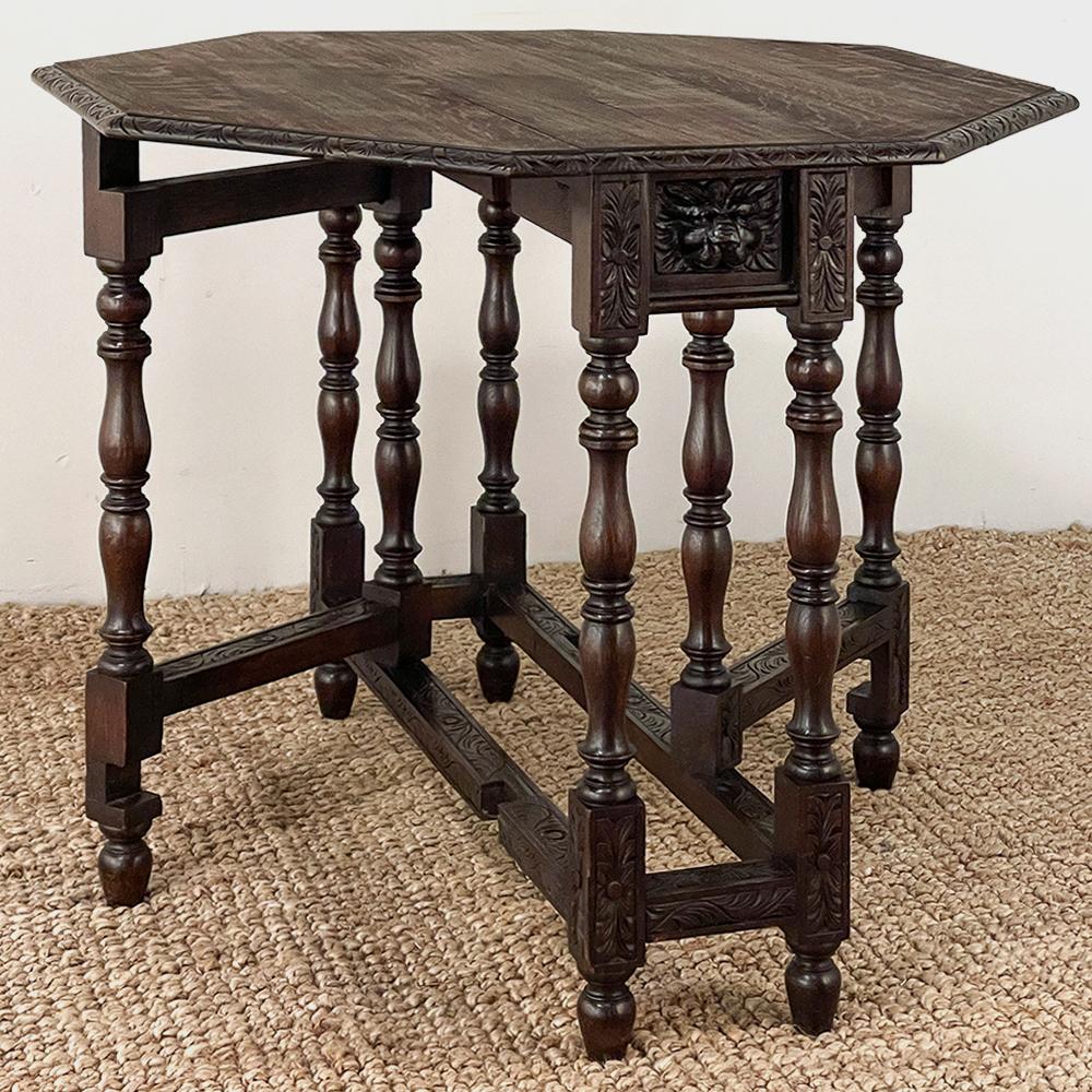 Antique French Renaissance Octagonal Drop Leaf Gate Leg Table is a great choice for the efficient floor plan! Hand-crafted from solid oak, it features a drop leaf gate leg design that compresses down to a tabletop only 34.5W x 11D, perfect for