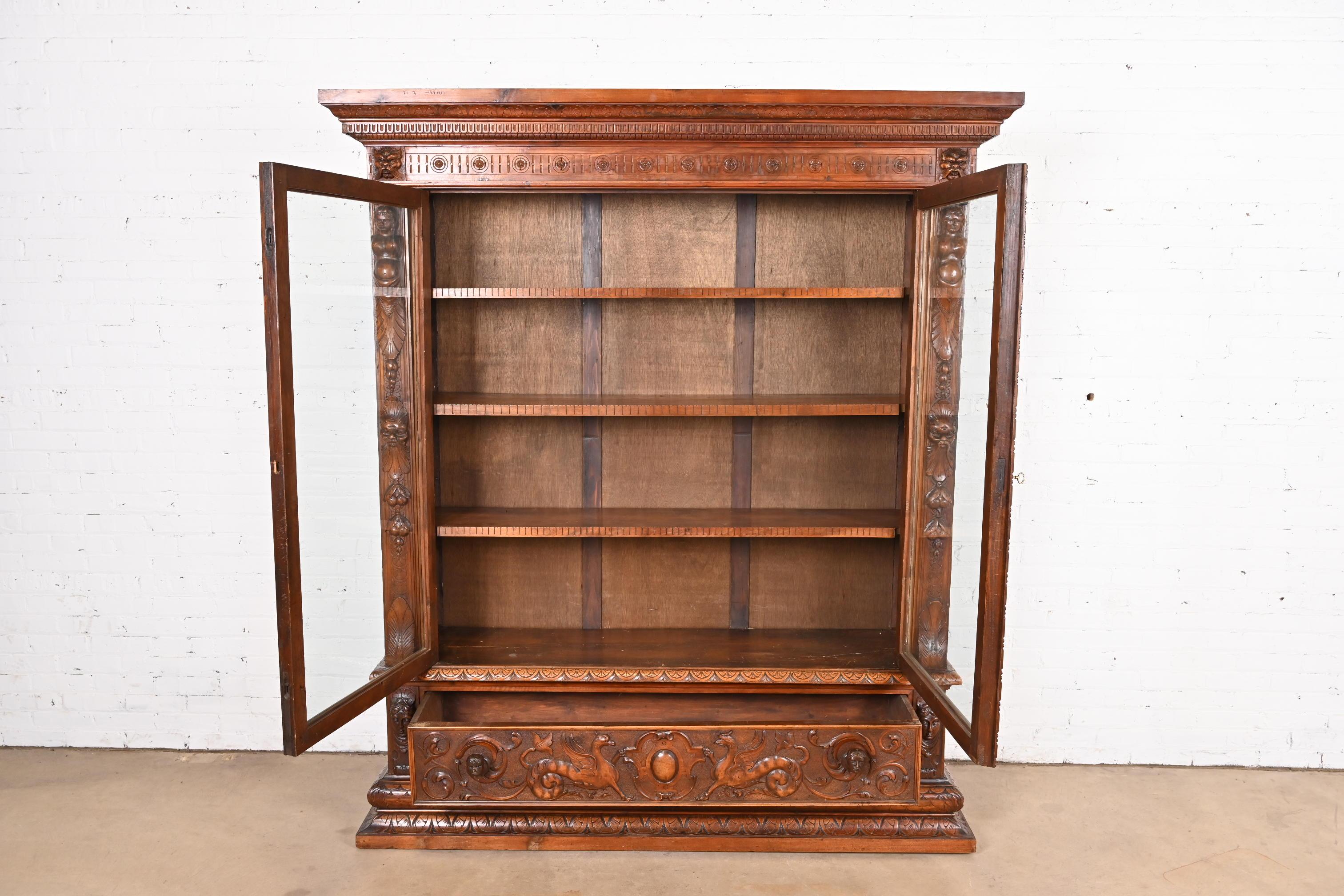 XX secolo Antique French Renaissance Ornate Carved Walnut Bookcase Cabinet, CIRCA 1900 in vendita