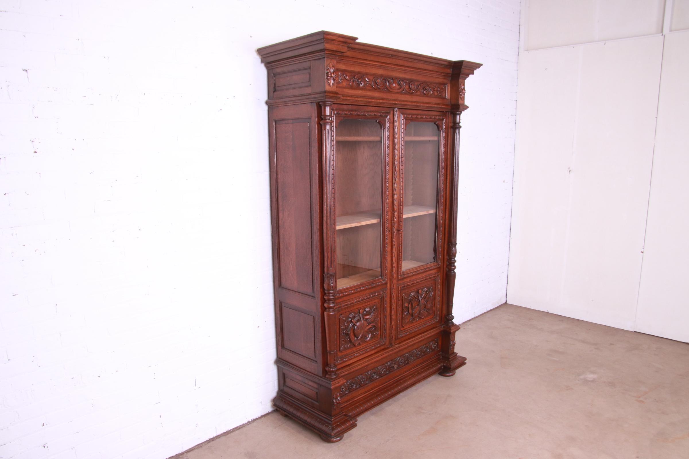 20th Century Antique French Renaissance Revival Carved Oak Bibliotheque Bookcase Cabinet