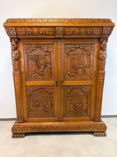 Antique French Renaissance Revival Carved Oak Cabinet with Figural Panels