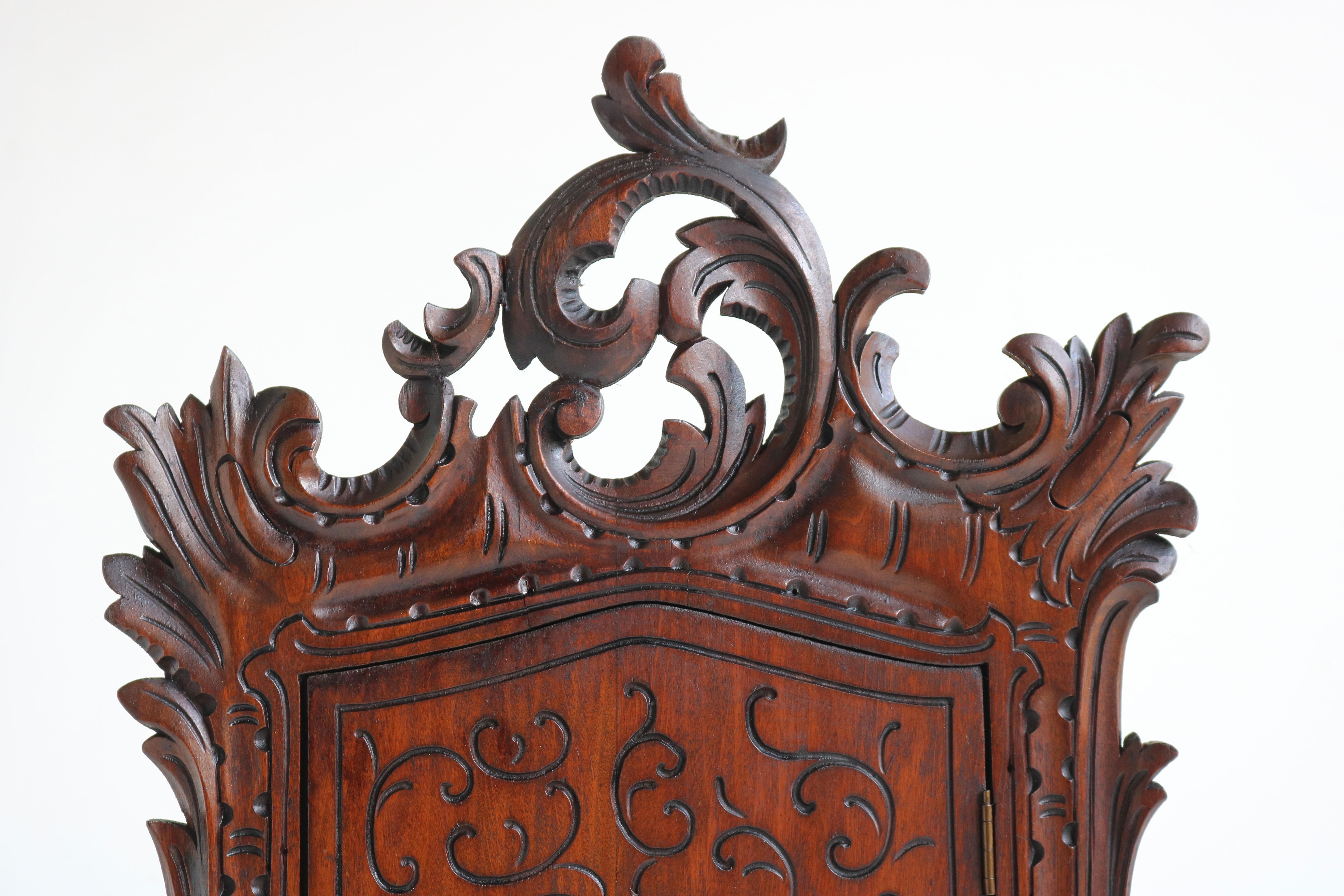 carved wood wall cabinet