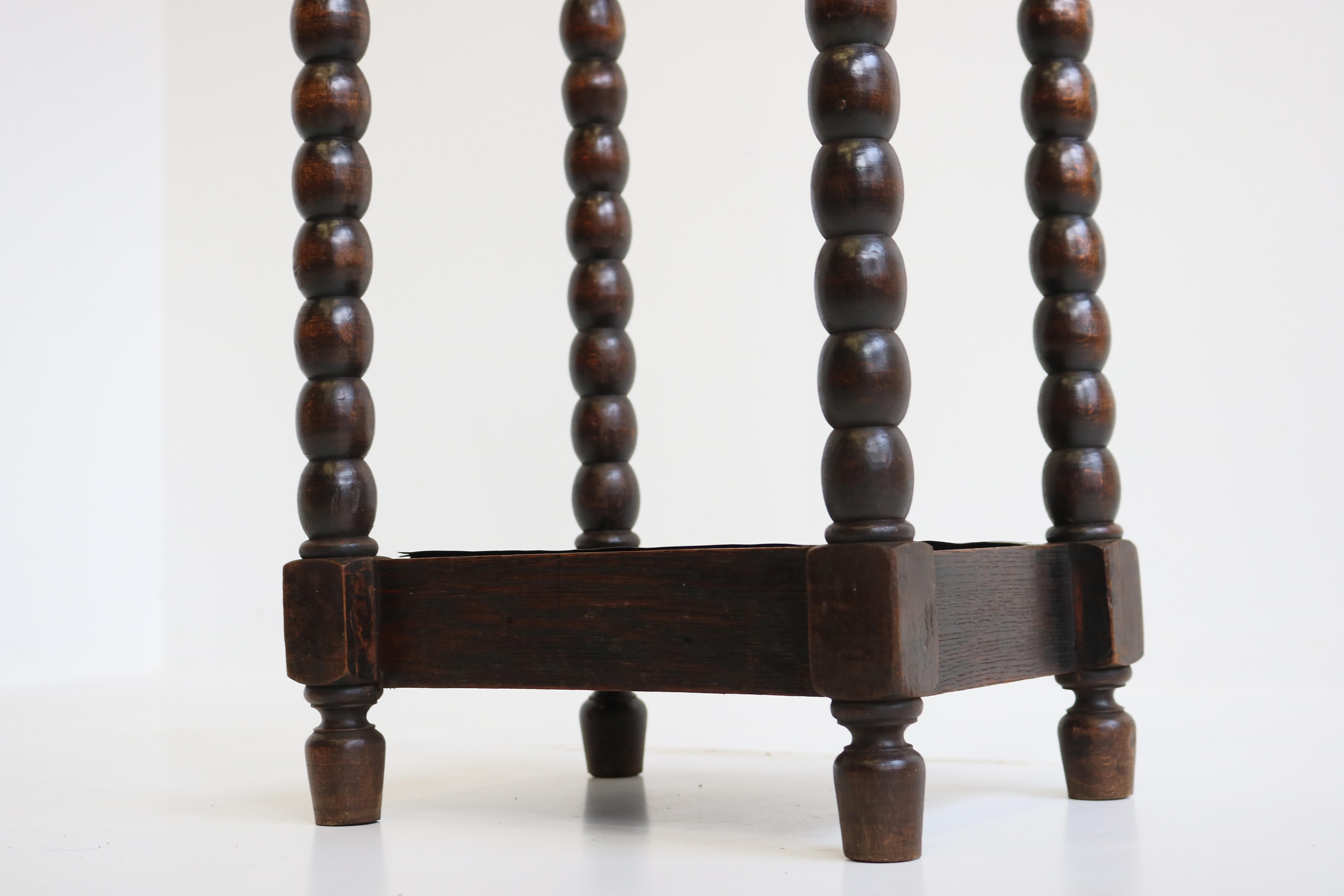 Rare antique French Renaissance Revival umbrella stand / stick holder from the 19th century in solid oak. 
Decorated your hallway with this marvelous antique piece. Hand carved balls (very similar to barley twist) with 2 Lion heads on top. 
The 2