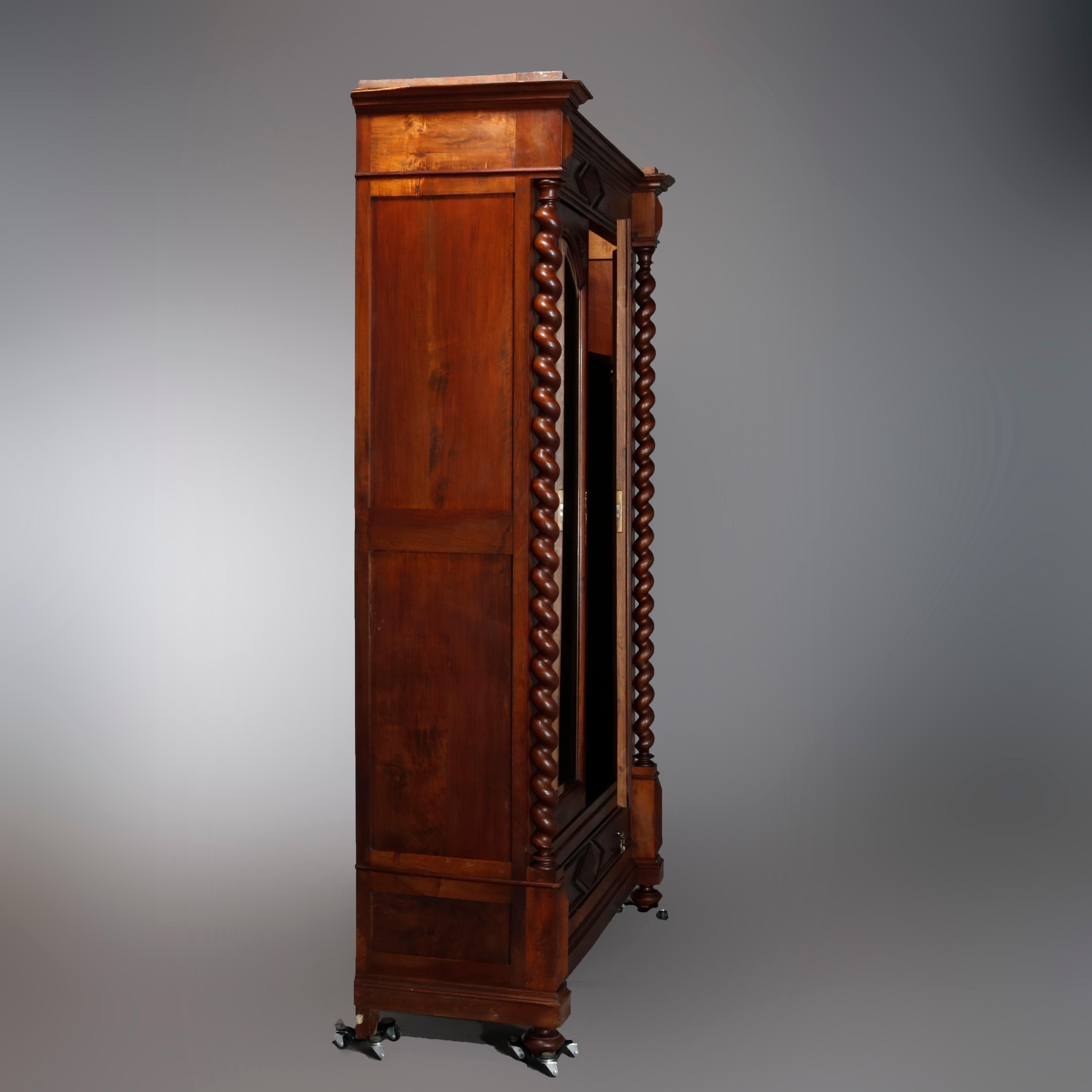 Carved Antique French Renaissance Walnut Wardrobe with Barley Twist Columns, circa 1890