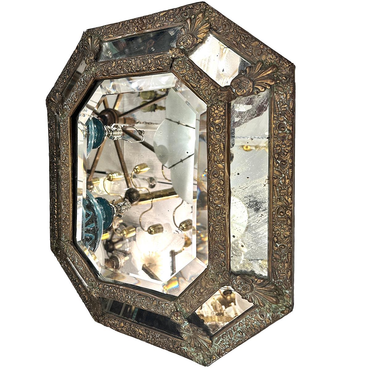 A circa 1960's French repoussé mirror with foliage motif.

Measurements:
Height: 21