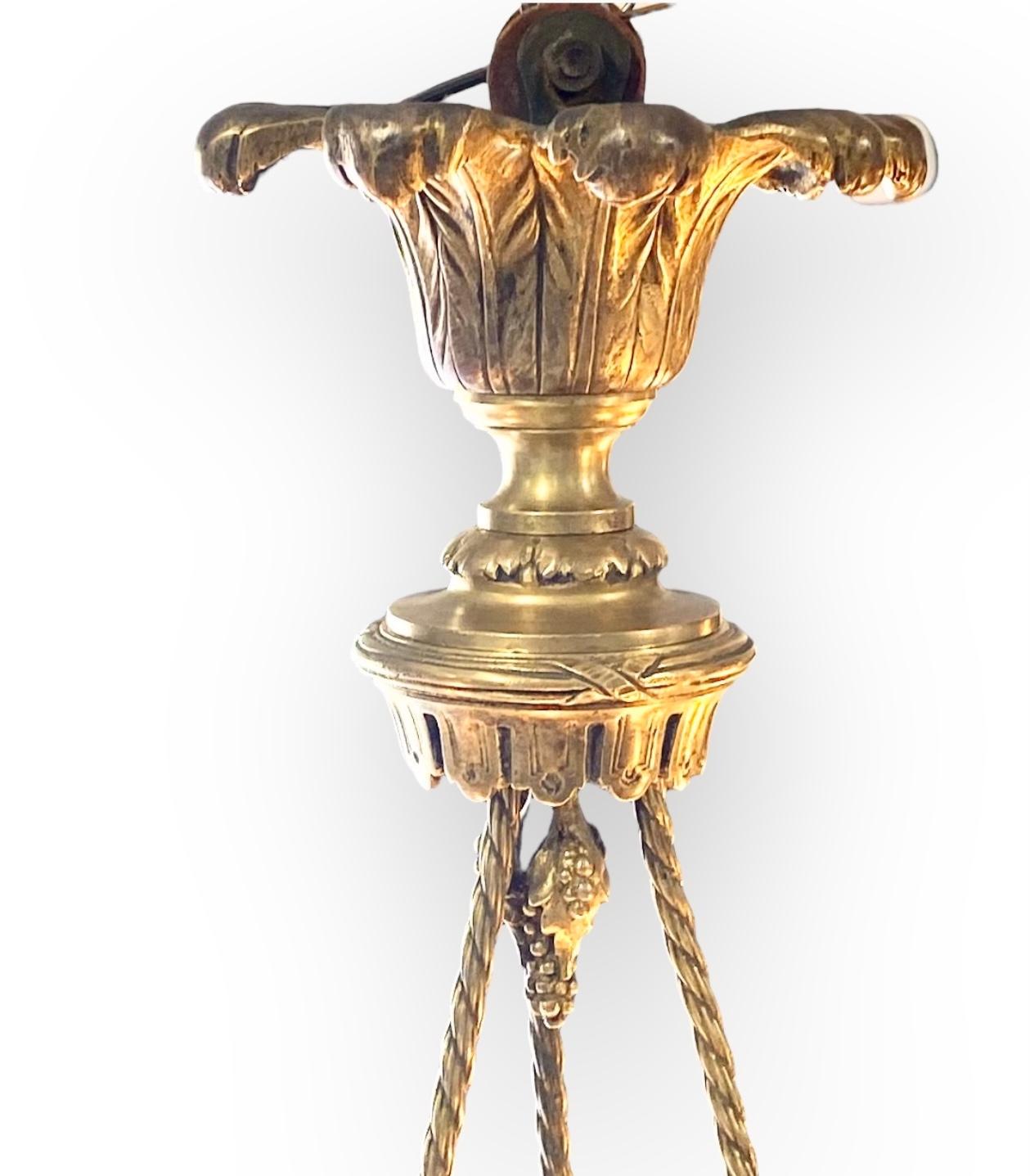 A superb antique French 1920’s Beaux Arts reverse painted glass and gilded bronze pendant chandelier. The three bronze supports resembling rope, tied and knotted below an ornate gilded bronze crown of feathers. The glass dome beautifully reverse