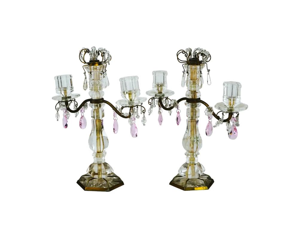 A pair of antique French Belle Epoque Rock Crystal and bronze candelabras with two light bowls. The candelabras are adorned with pink Rock Crystal drops. Unmarked. Circa: Mid 19th century. Antique and Vintage European Bronze Candelabras and Lighting