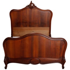 Antique French Rococo Carved Flame Mahogany Full Bed, 20th Century