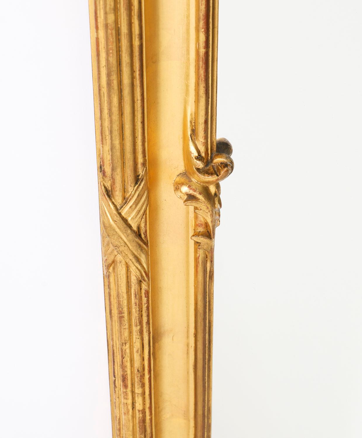 This is an exquisite antique French Rococo carved giltwood wall / overmantel mirror, Circa 1840 in date.

The beautifully sculpted rectangular giltwood frame is decorated with cluster columns with an abundance of curves, counter-curves, undulations,