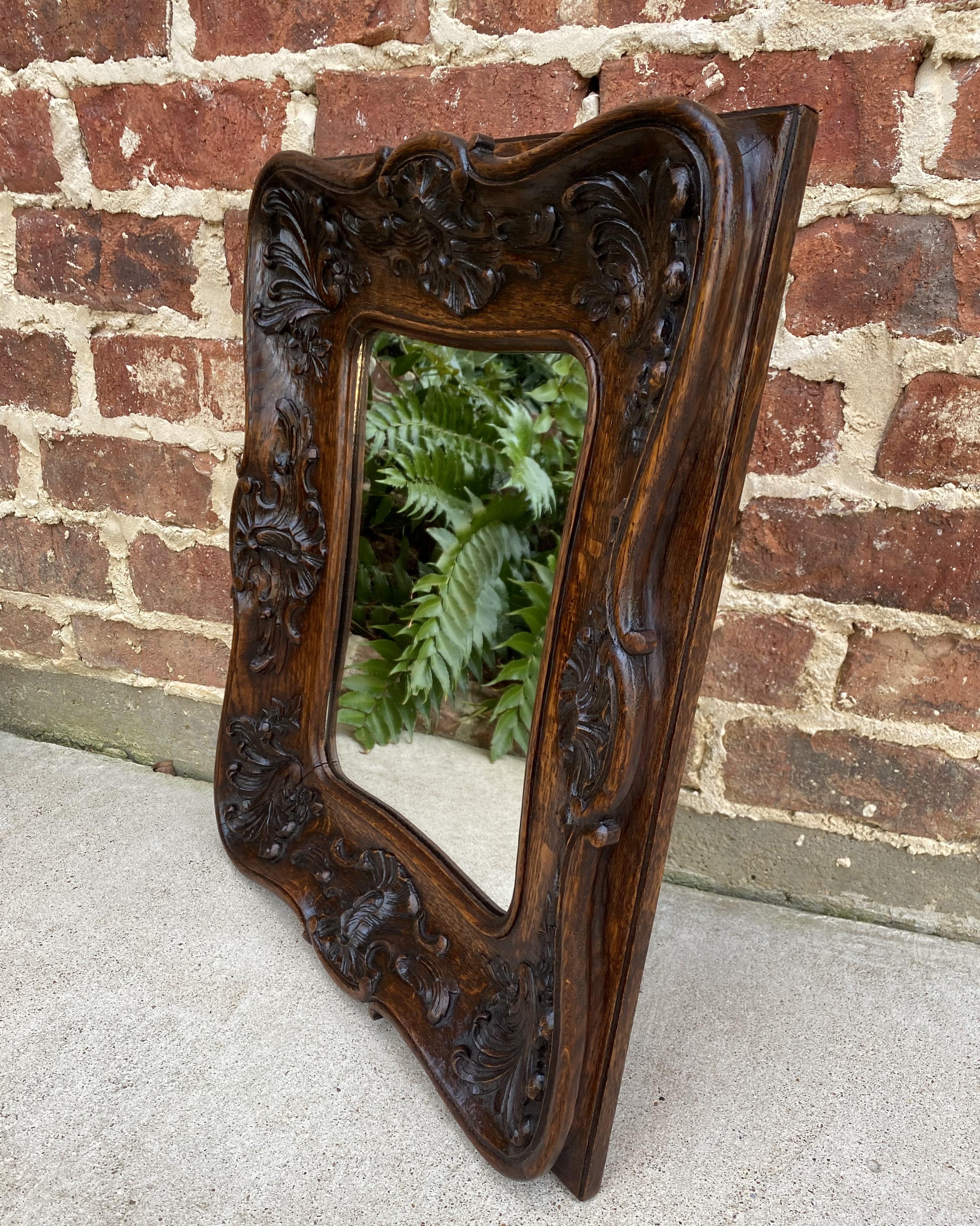 Exquisite Antique French Oak Highly Carved Framed Wall Mirror c. 1920s

Traditional and timeless~~popular French style~~frame is CARVED from ONE PIECE of oak with finished oak wooden back~~beautiful floral accents~~perfect for an entry hall,