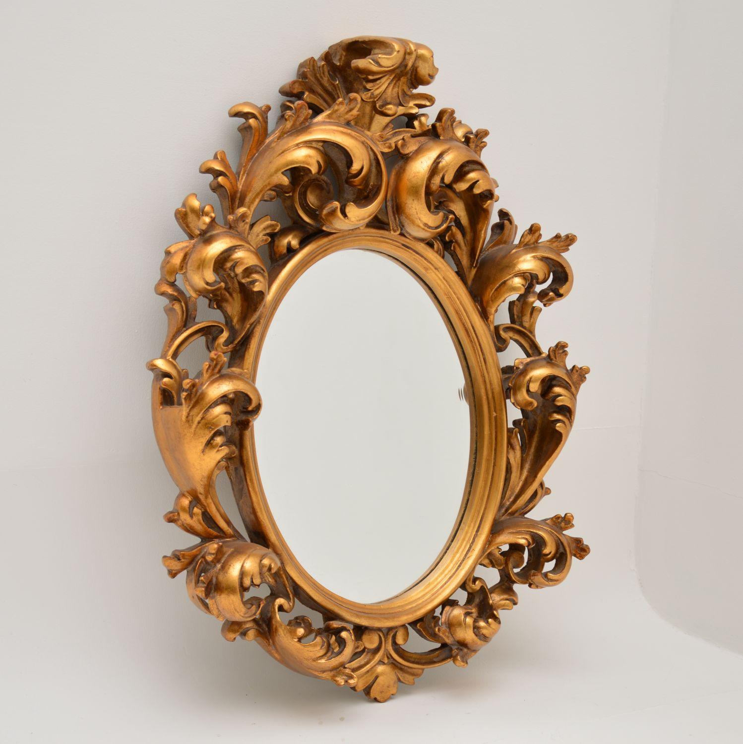 A fabulous gilt wood mirror in the antique French Rococo style. This dates from around the 1950’s period and it is of extremely fine quality.

The carving on the gilt wood frame is deep and intricate, it is most impressive. The gilt wood is in