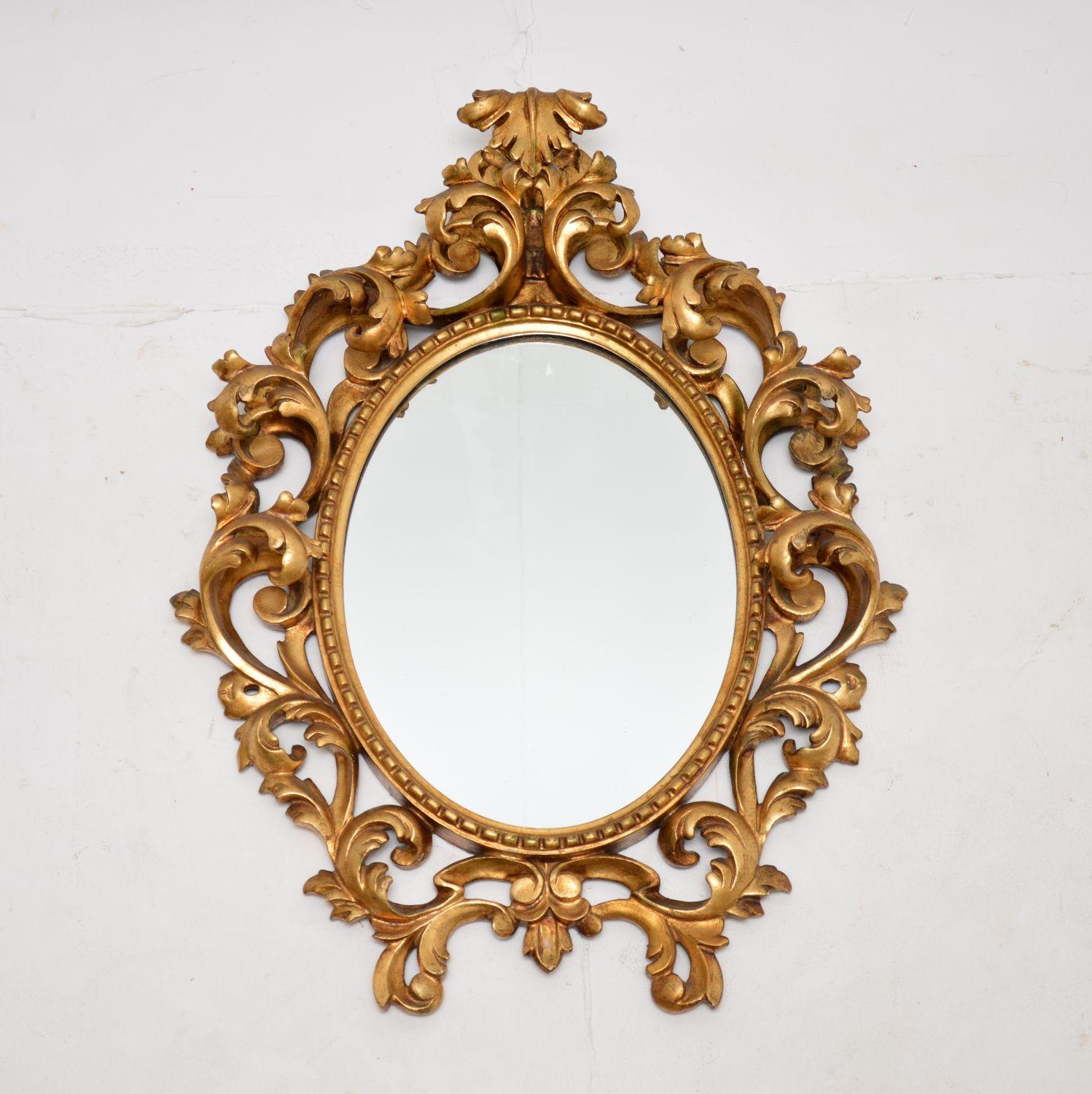 A fabulous gilt wood mirror in the antique French Rococo style. This dates from around the 1930’s period and it is of extremely fine quality.

The carving on the gilt wood frame is deep and intricate, it is most impressive. The gilt wood is in great