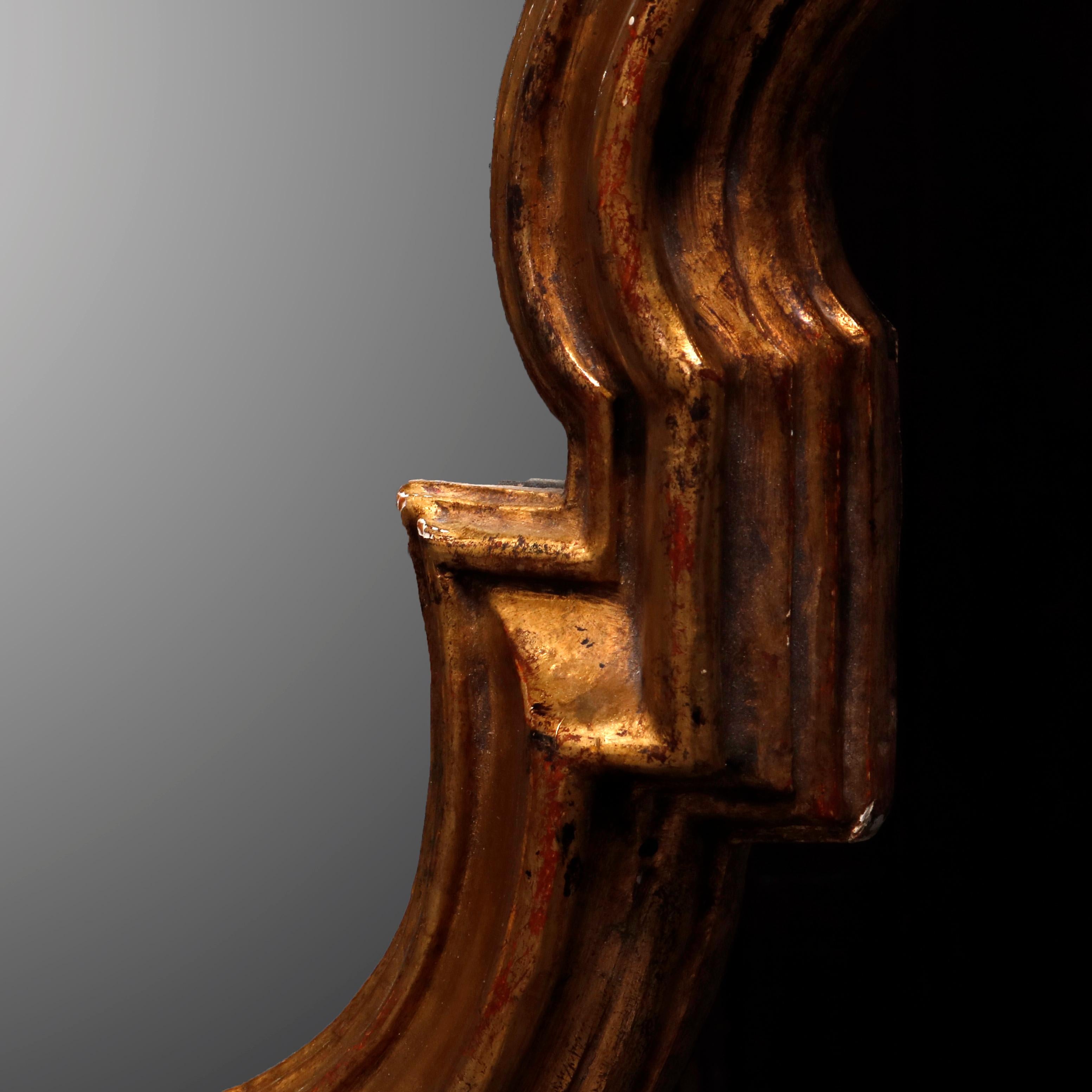 20th Century Antique French Rococo Stylized Shield Form Giltwood Wall Mirror, circa 1920