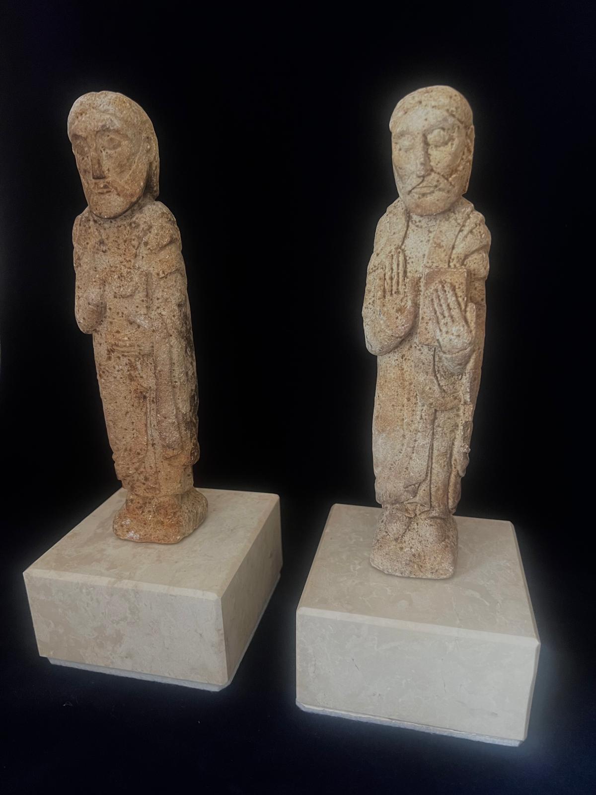 An extremely rare pair of original 11th century French Romanesque limestone hand carved sculptures of Saint Peter and Saint Paul. Each figure is represented on a marble block, without the pedestal the hight of the figures is 21 cm and width is 3.5