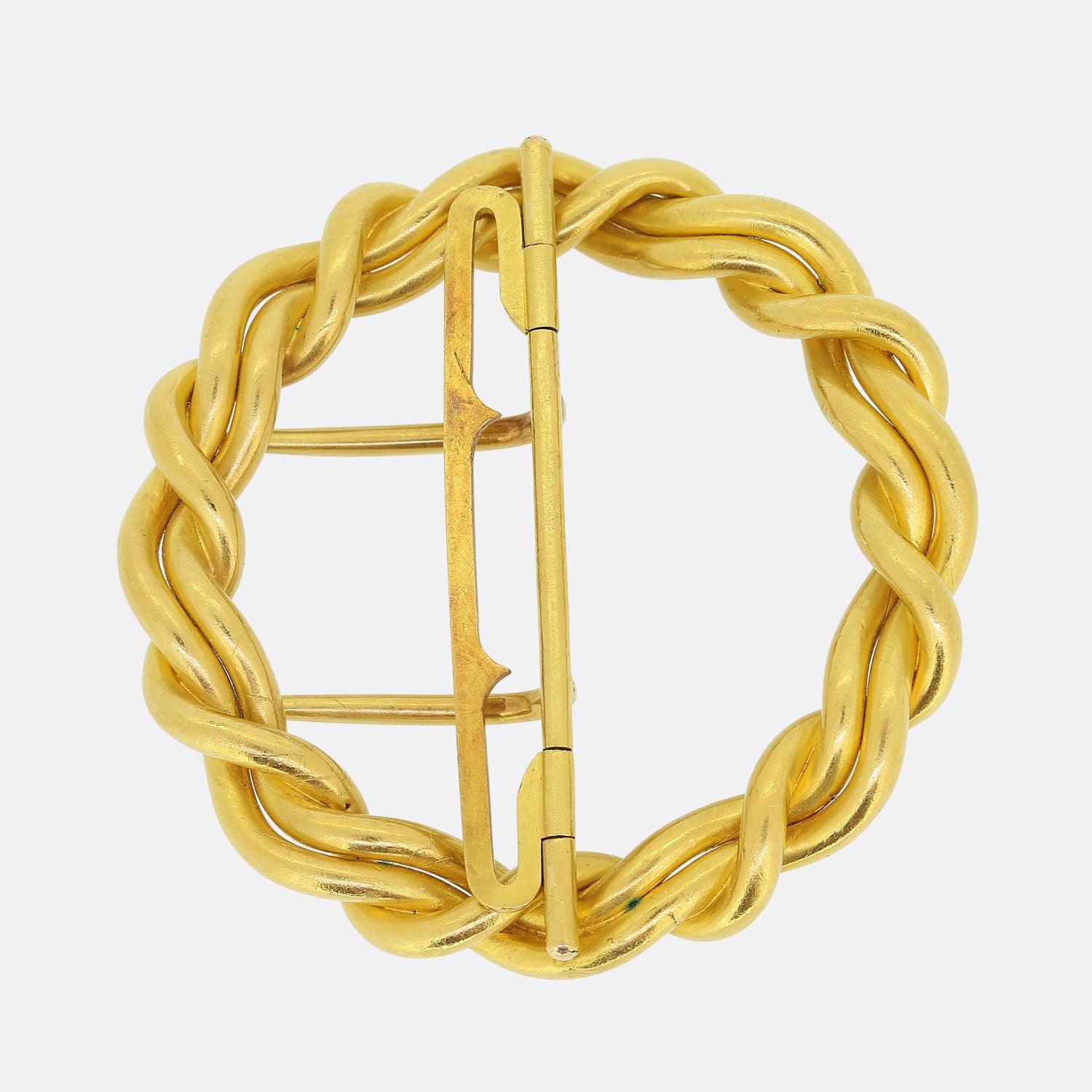 Here we have an antique belt buckle crafted in France around the turn of the 20th century. This 22ct yellow gold art nouveau piece showcases a intertwining, twisted design which follows an undulating rounded shape. Complimenting the rich 22ct colour