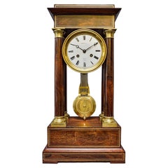 Pendule de cheminée française ancienne et saisissante en bois de rose