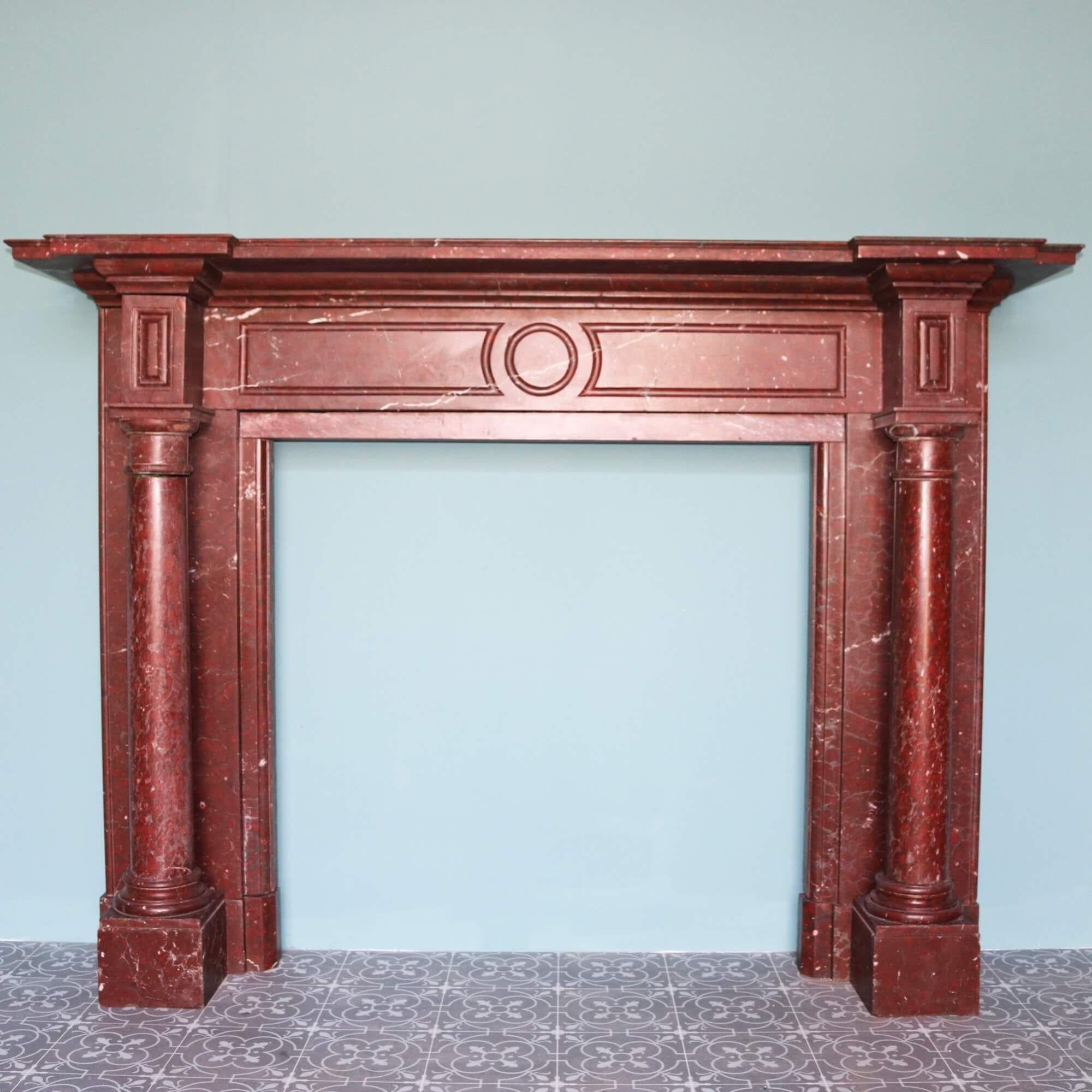This spectacular, large scale French fireplace makes an impressive focal point in a large room with its prestigious design and rich Rouge Griotte marble craftsmanship. Originating from France, it is more than 150 years old and dates from the late