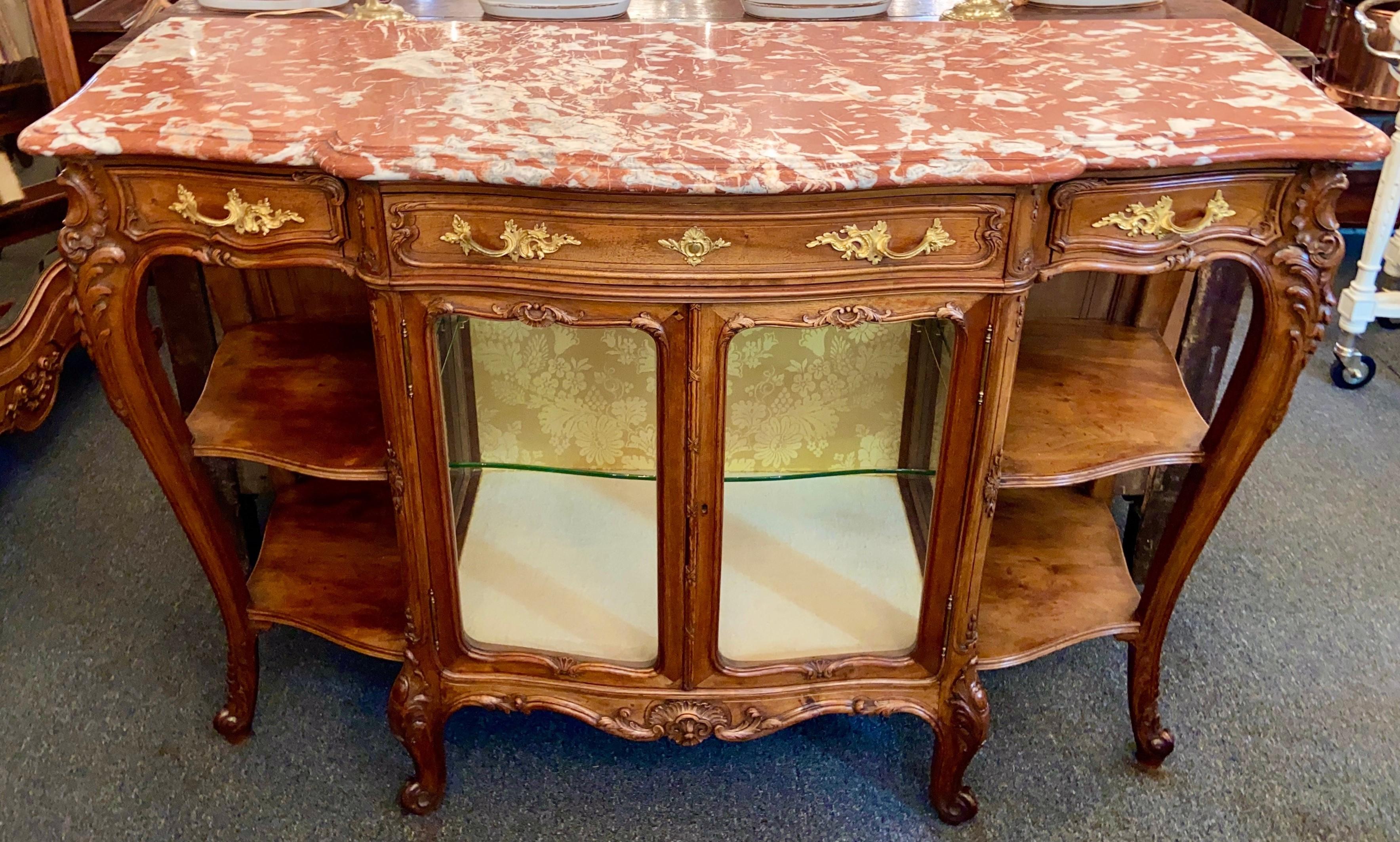 Antique French rouge marble-top walnut buffet with glass doors, Circa 1890-1910.