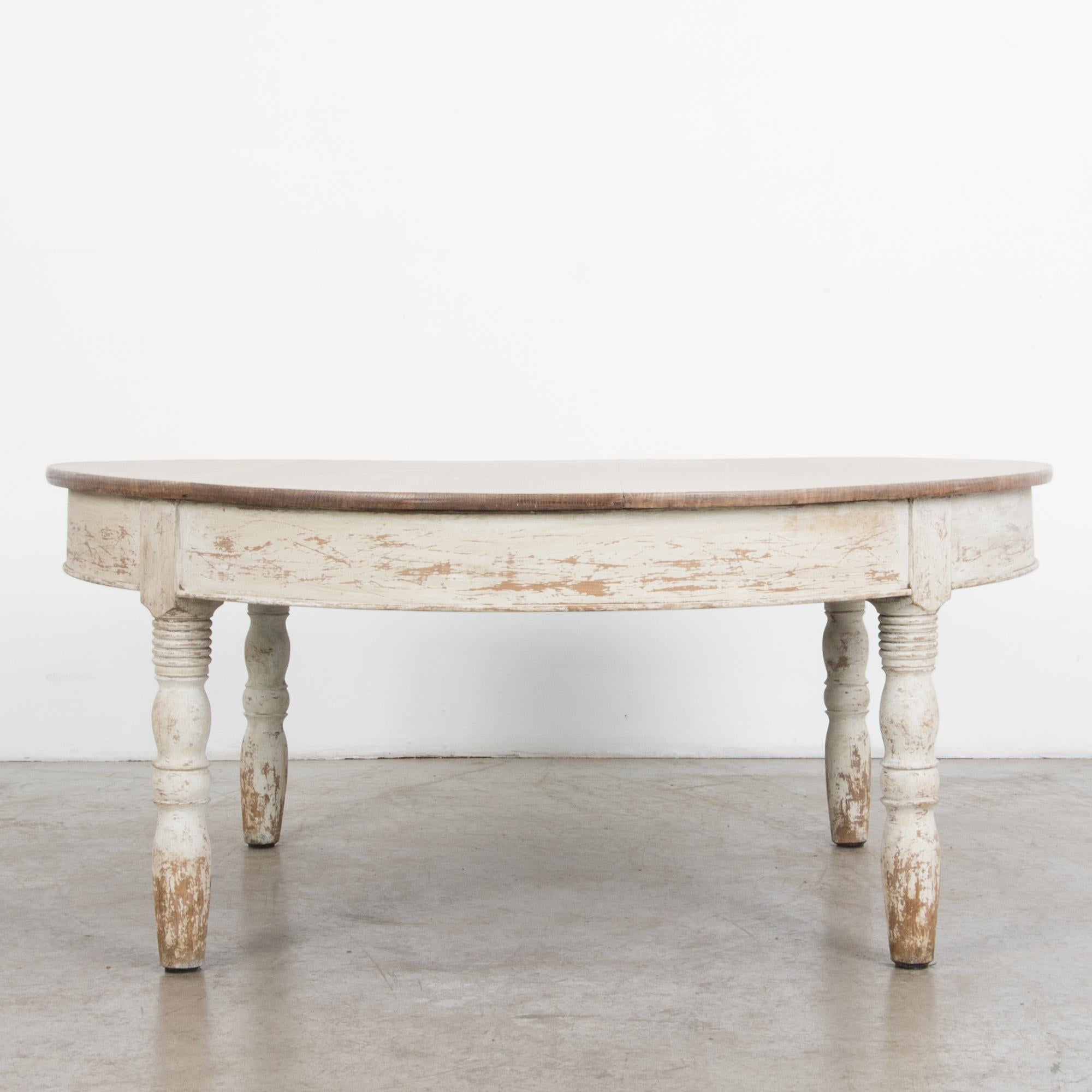 A simple oak table from France, circa 1900. Traditional construction borrows
from the lineage of European craftsmanship, with unique distressed finish. The worn patina gives suggestion of time and history, with a timeless shape and subtle