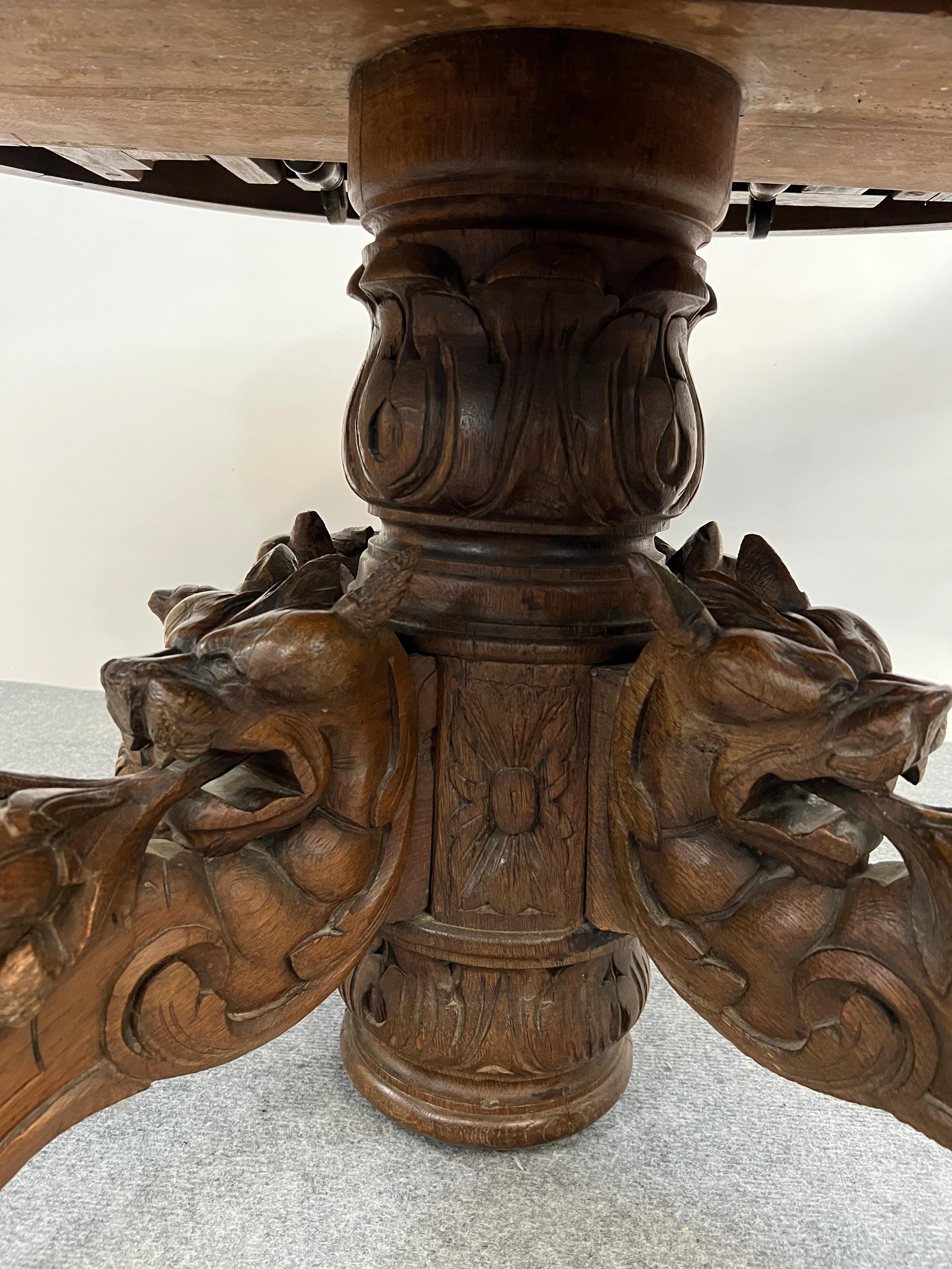 Carved Antique French round coffee table pedestal Black Forest hunt table griffons 19th For Sale