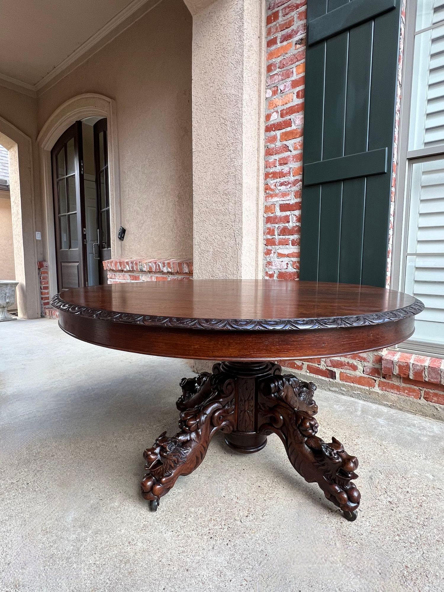 Antique French ROUND Dining Hunt Game Table Carved Oak Black Forest Pedestal.

Direct from France, a large and substantial 19th century hand carved round table!
Superior carvings, craftsmanship and artistry; the huge turned pedestal has carved