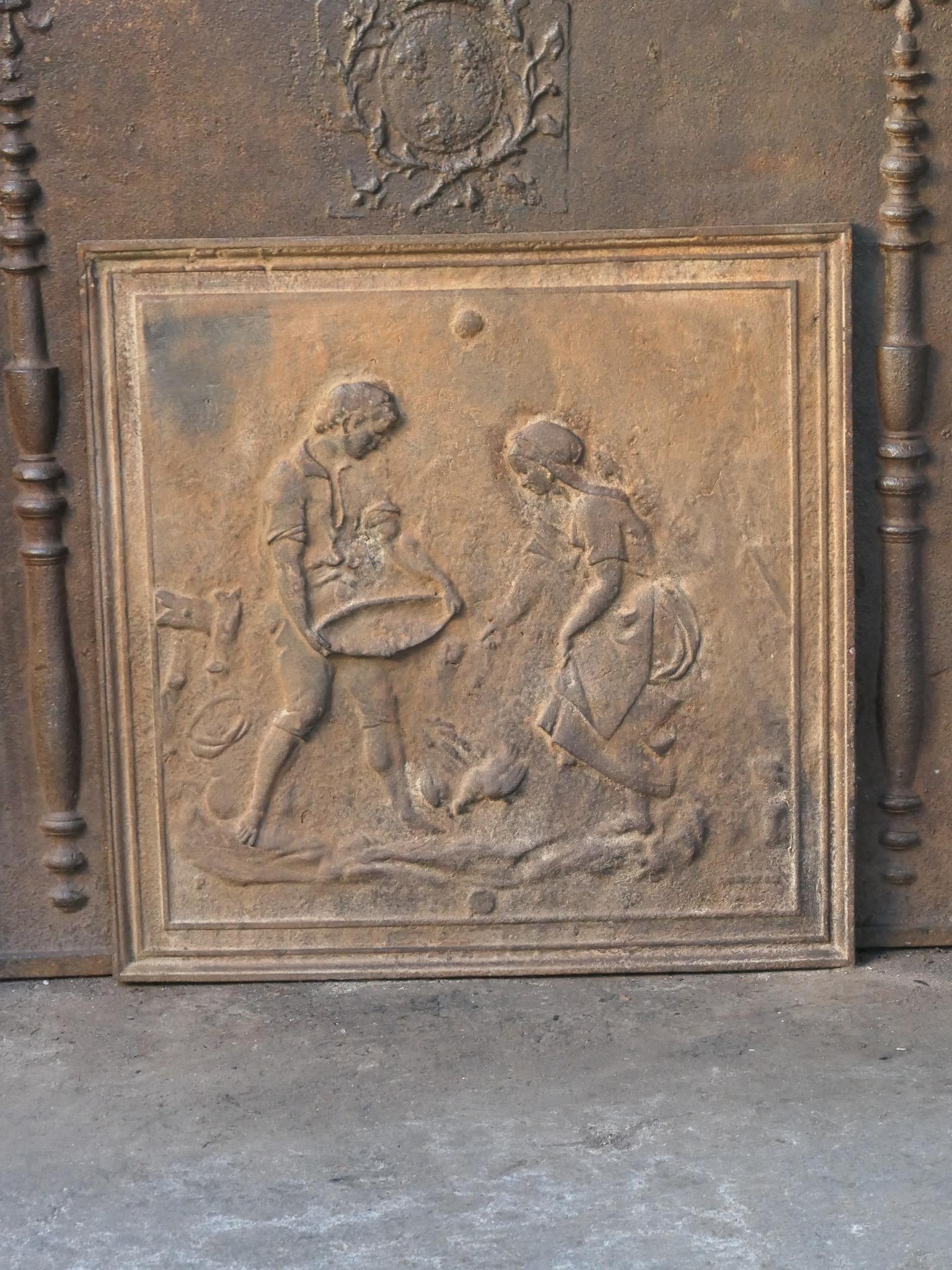 Plaque de cheminée française du 20e siècle représentant une scène rurale. 

La plaque de cheminée est en fonte et a une patine brune naturelle. Sur demande, il peut être réalisé en noir / étain. L'état de la plaque de cheminée est bon, pas de