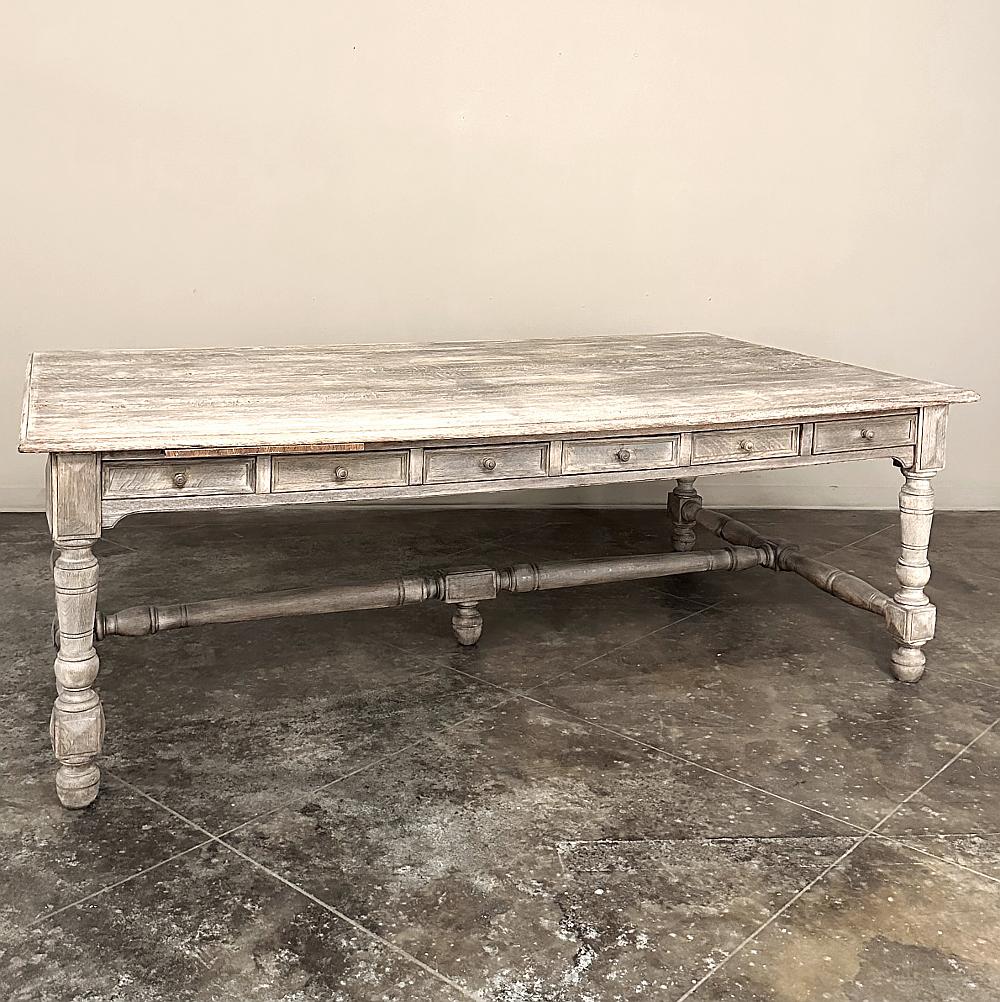 Antique French Rustic Neoclassical Executive Desk ~ Conference Table was crafted on a truly grand scale from dense, old-growth oak which has been painstakingly stripped by our expert in-house staff to create a soft texture and appearance, while