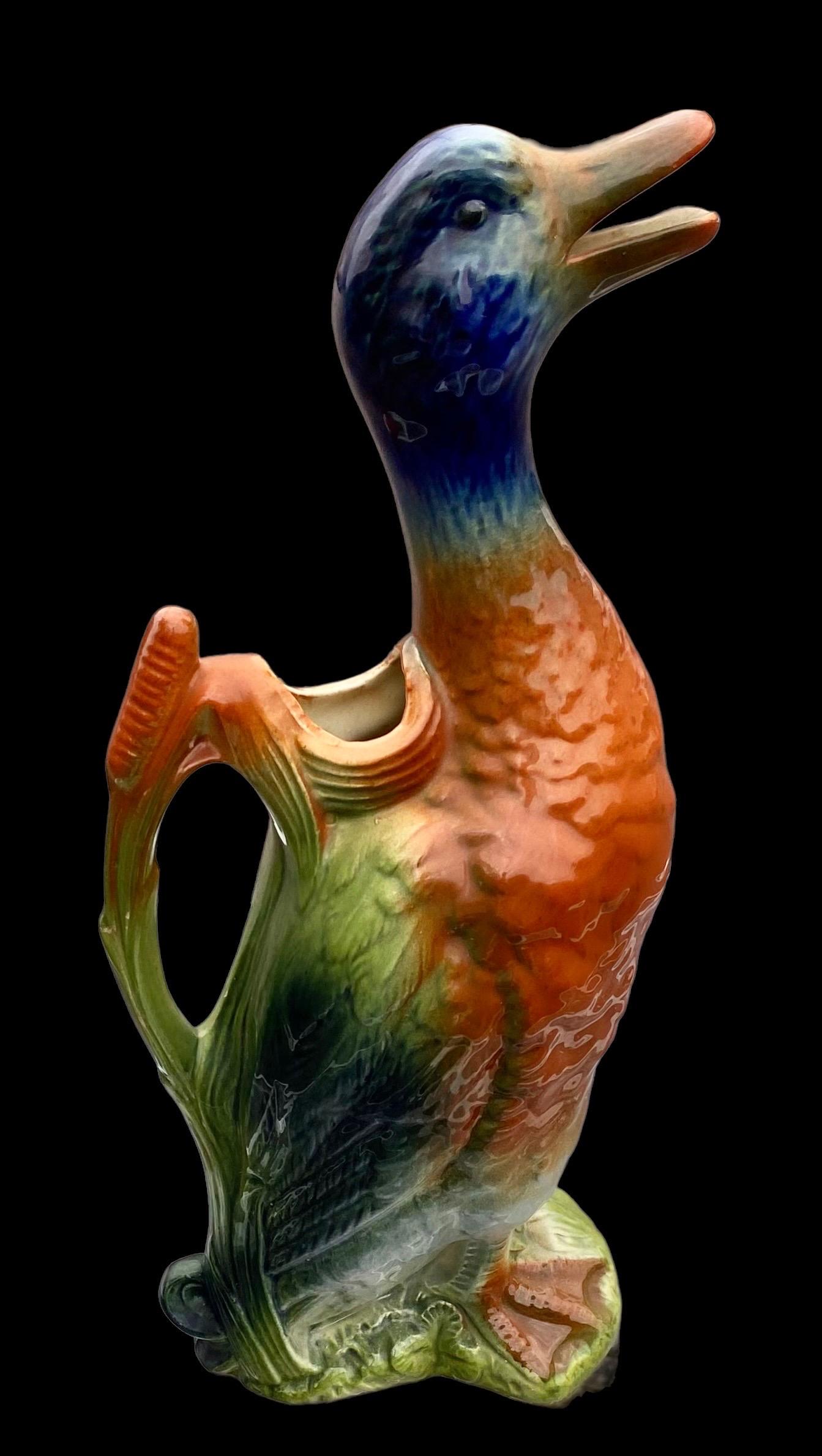 This exceptional Saint Clement majolica drake, mallard water pitcher will bring joy to any table. Highly collectable with brilliant colors and texture and all hand crafted at the highly respected and revered Saint Clement factory in France. A feast