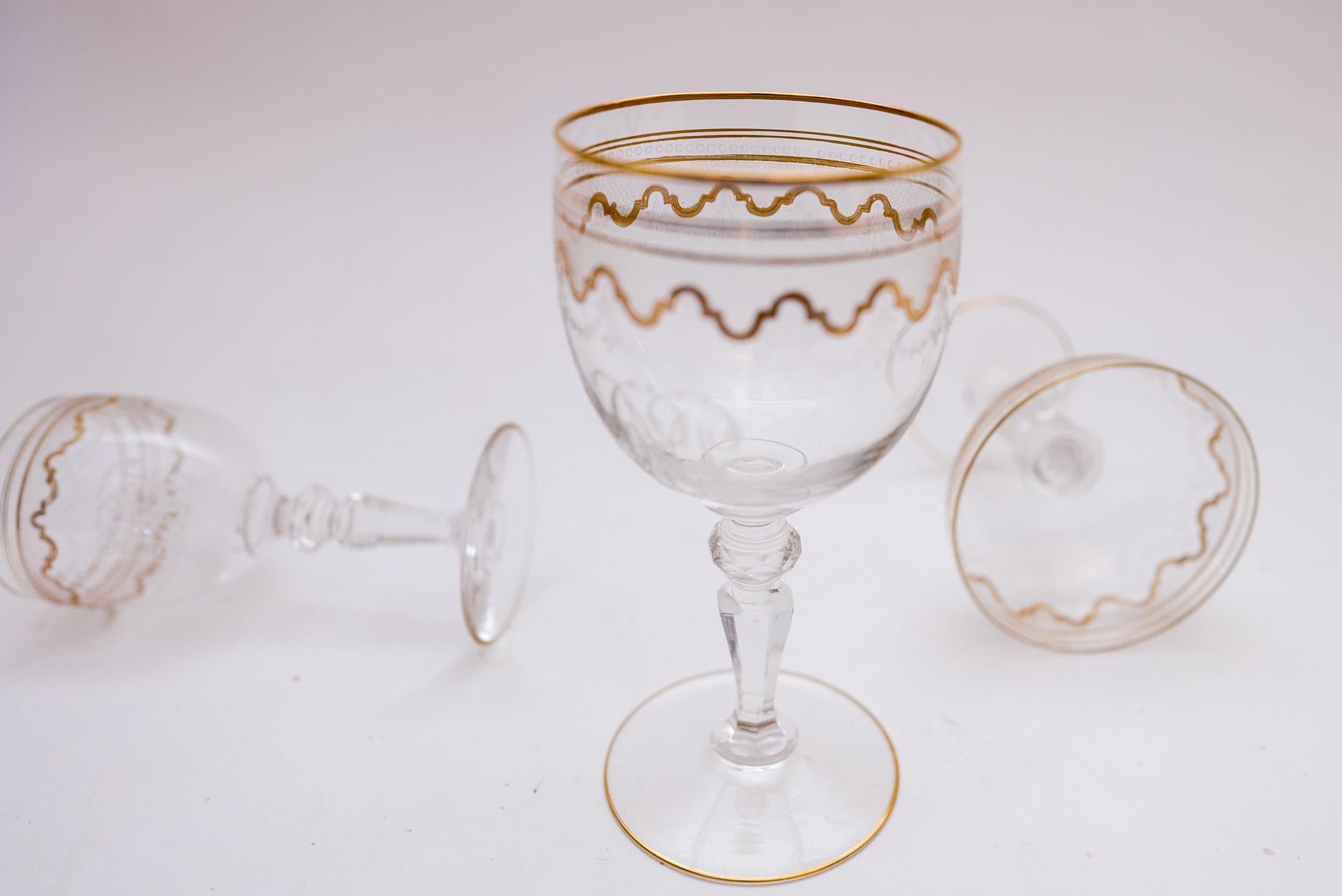 A great collection from one of the world's re known crystal companies:
 Saint Louis, France. This collection of 33 pieces includes 
11 Water goblets six and one half inches high.
 12 Wine glasses that are 5 and one quarter inches high.
 10