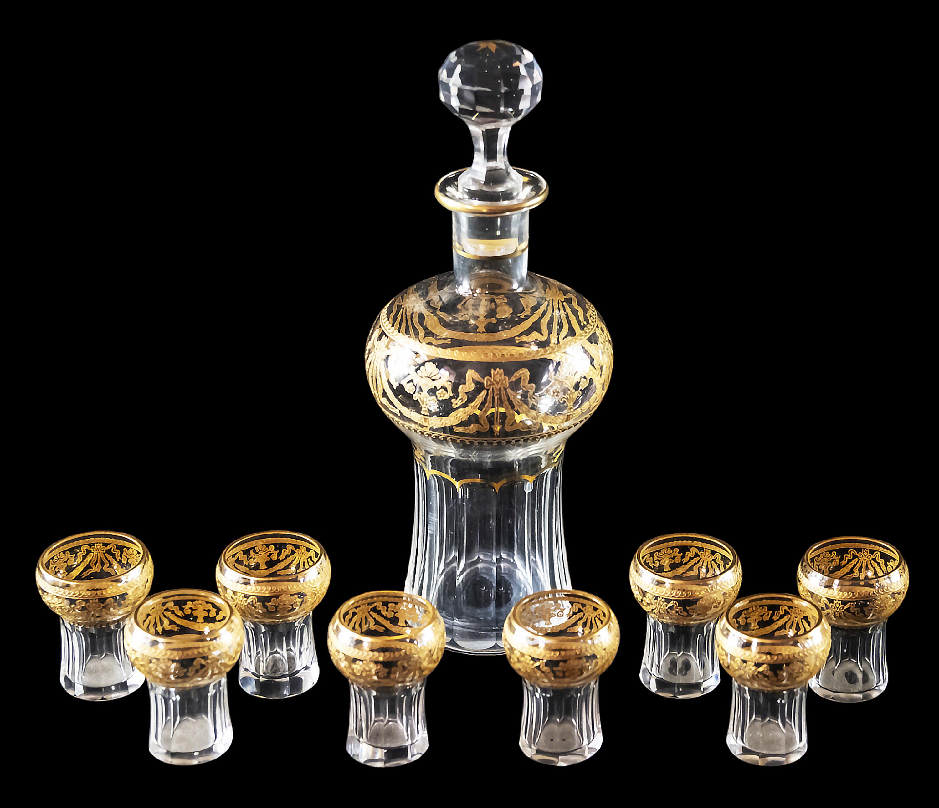 Antique French Saint Louis cut crystal liqueur set finely decorated with gilded ornaments, that includes 8 pieces of liqueur glasses, 1 piece decanter/carafe.
Model 738, 1916 catalog.
Before 1936, the old productions were not