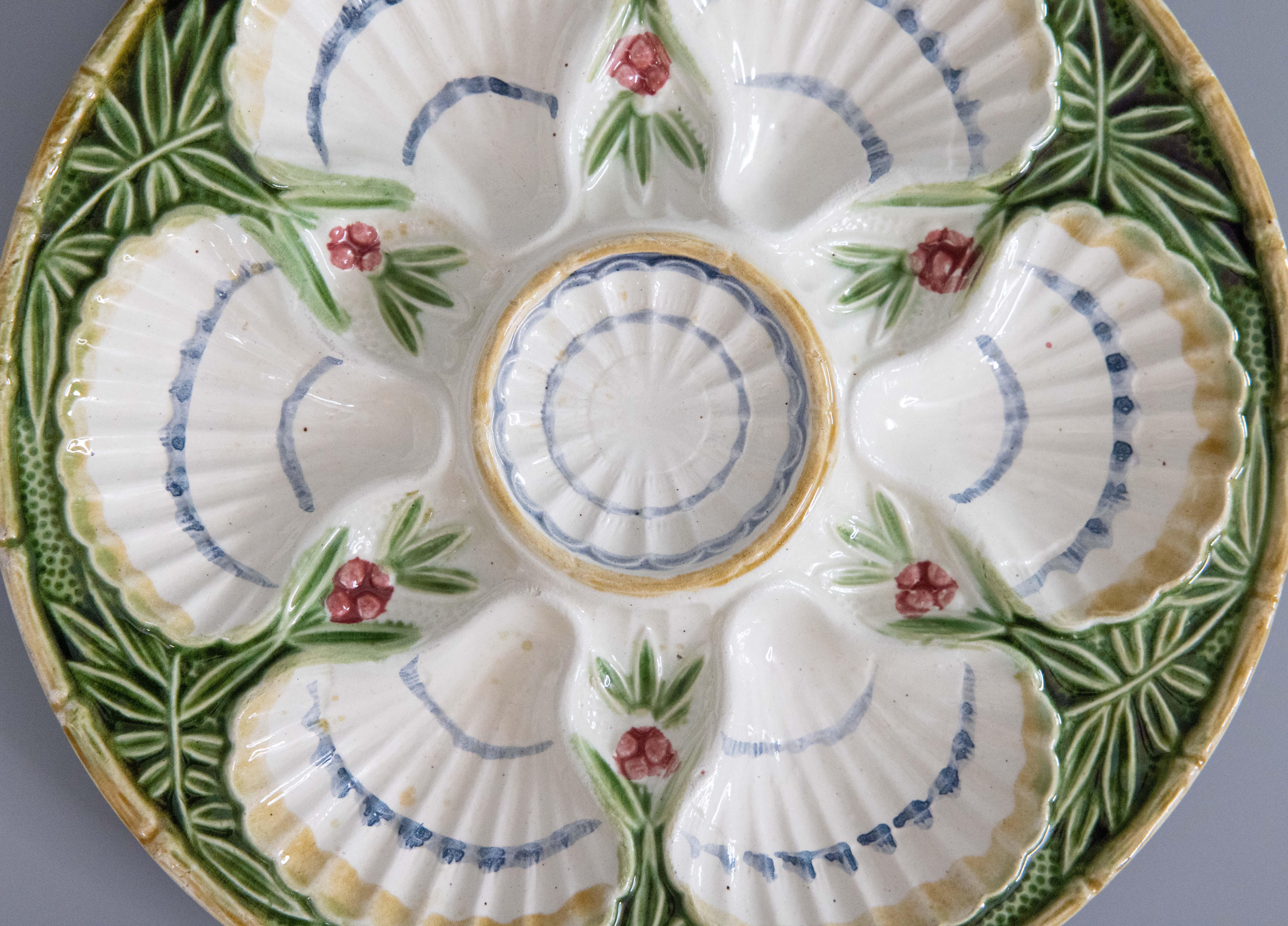 A gorgeous antique French Salins majolica oyster plate with berries and bamboo design, circa 1890. Impressed mark 