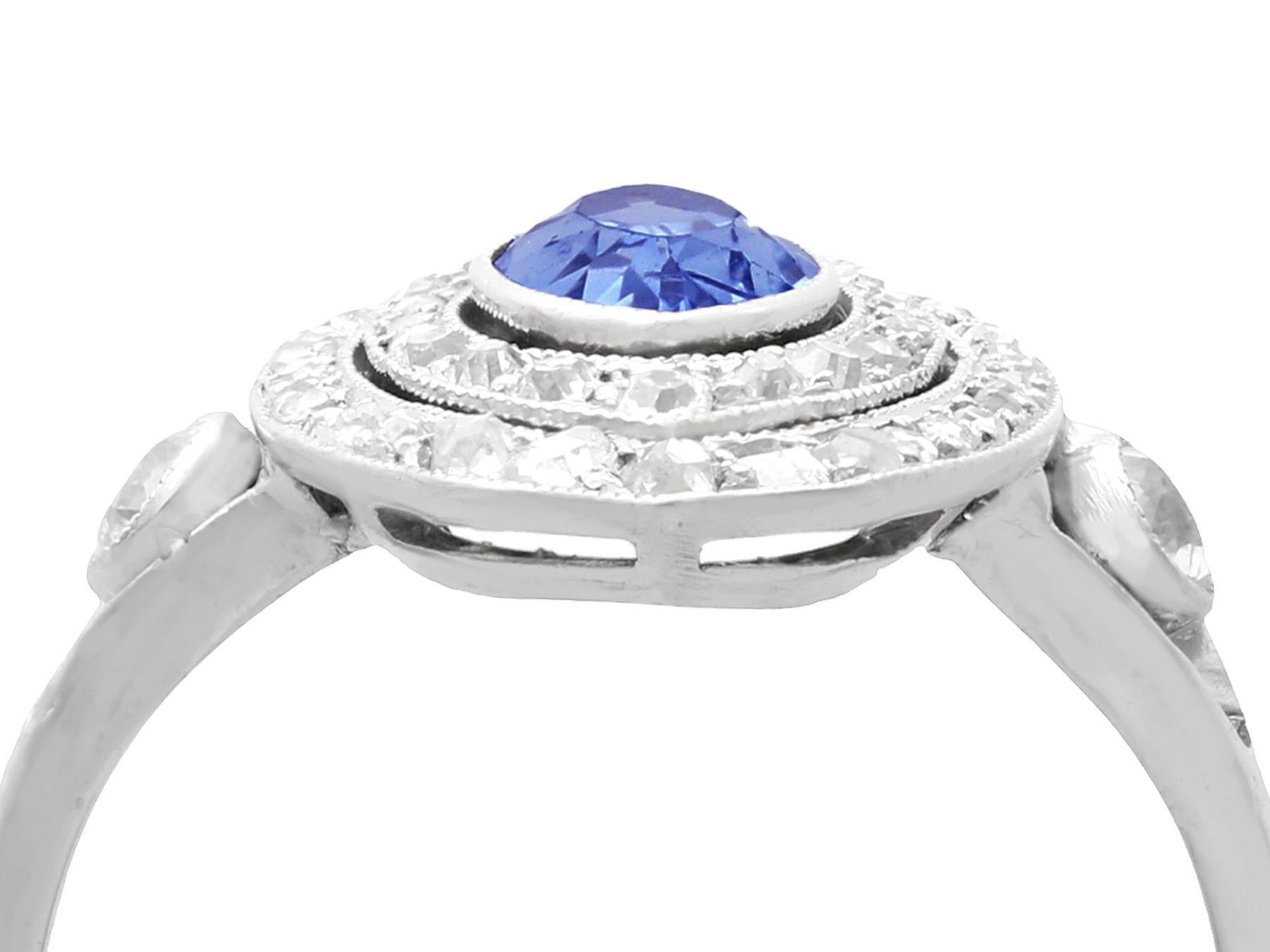 A stunning antique French 0.59 carat blue sapphire and 0.65 carat diamond, 18 karat white gold and platinum set marquise ring; part of our diverse antique jewelry collections.

This stunning, fine and impressive marquise sapphire and diamond ring