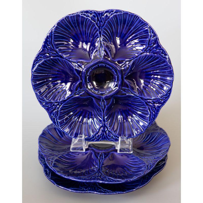 A rare antique French Sarreguemines oyster plate in gorgeous cobalt blue, circa 1920. Maker's mark on reverse. (The maker’s mark is under the glaze and because of the dark color can only be seen in direct sunlight.) It would look fabulous displayed