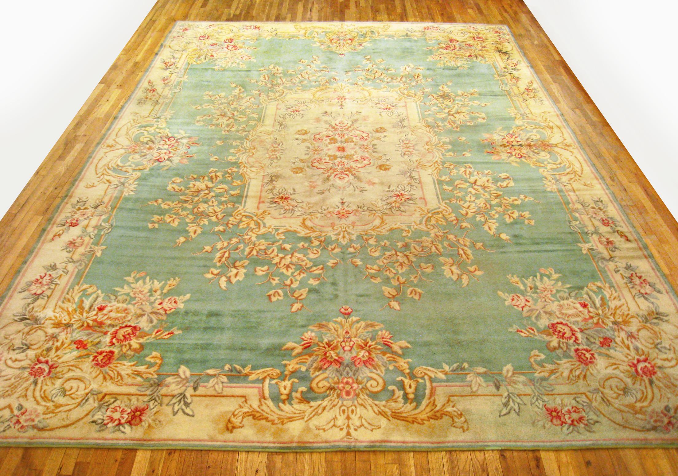 Antique French Savonnerie Rug, Large size, circa 1930

A one-of-a-kind antique European Savonnerie Oriental Carpet, hand-knotted with short wool pile. This beautiful rug features a central medallion on the light blue primary field, with beige outer