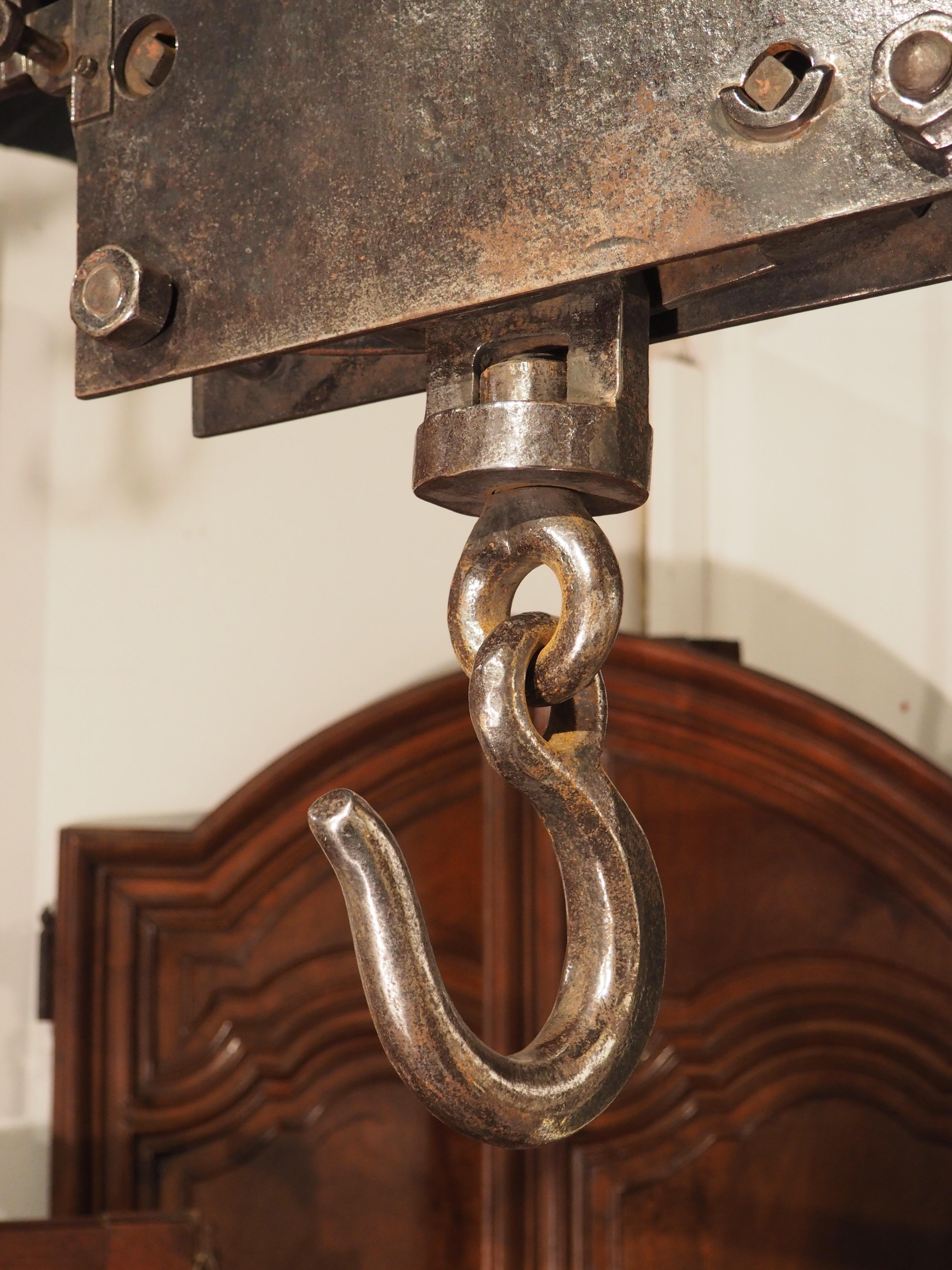 Produced by the French industrial factory, Usines de La Mulatiere Lyon, circa 1870, this large scale is known as a bascule Romaine, or “Roman seesaw”. It was originally designed to support up to 1000 kilograms (slightly more than a ton).

The