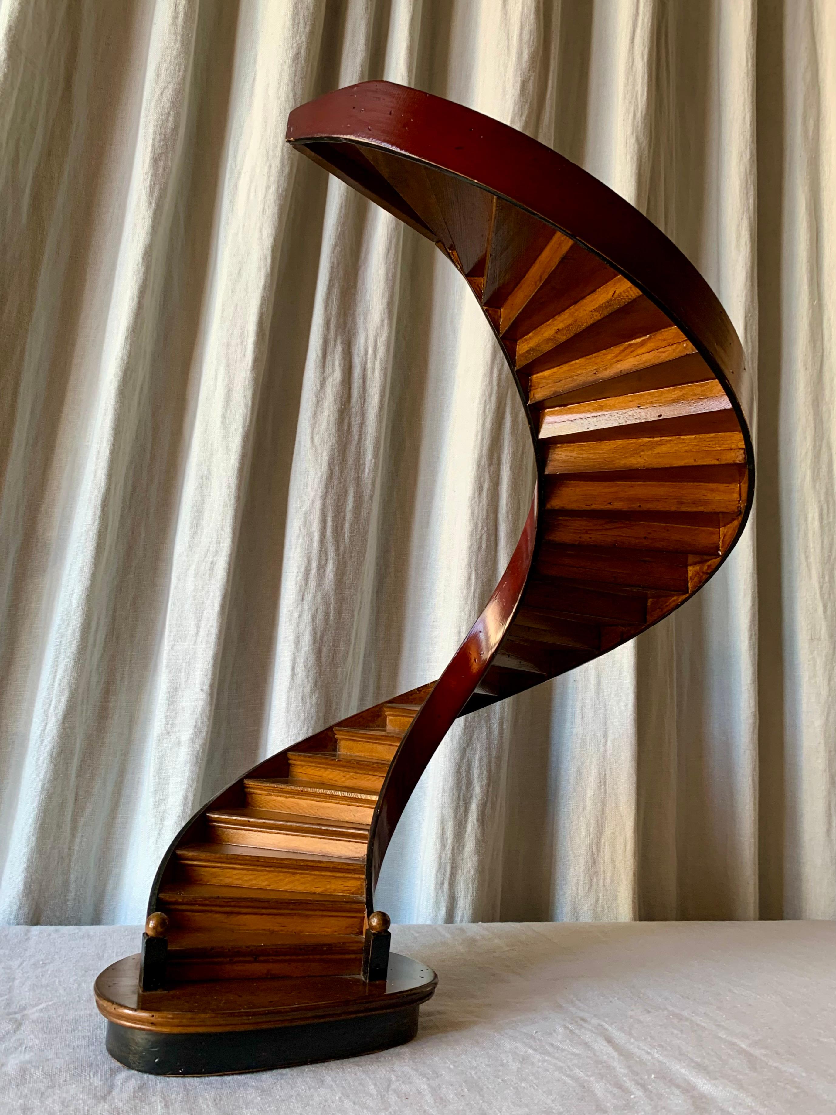 Magnificent ca. year 1900 scale model of a spiral stair case made in laquered and painted wood - originally made by builders to show a client how the finished product - the staircase - would look like. 

