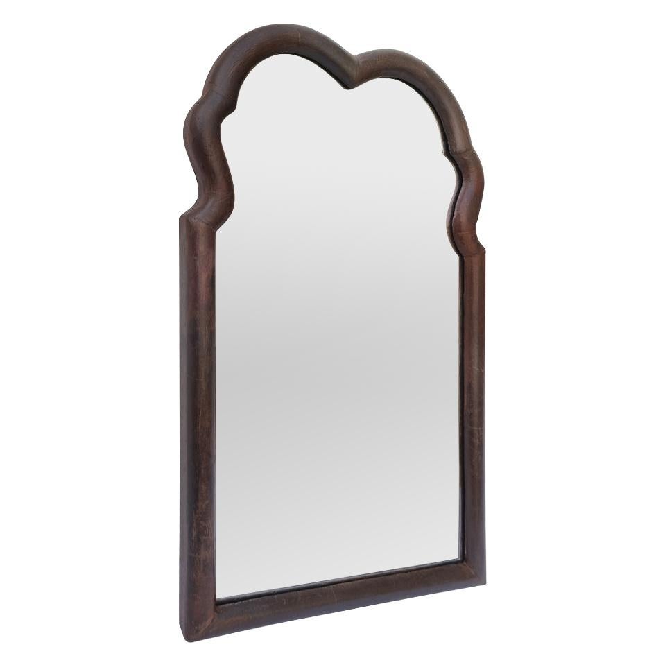 Elegant French antique wood wall mirror, circa 1890. Antique wood frame dark patina in a scalloped shape with a pediment. Antique frame width: 2.3 cm / 0.90 in. Glass mirror. Antique wood back.