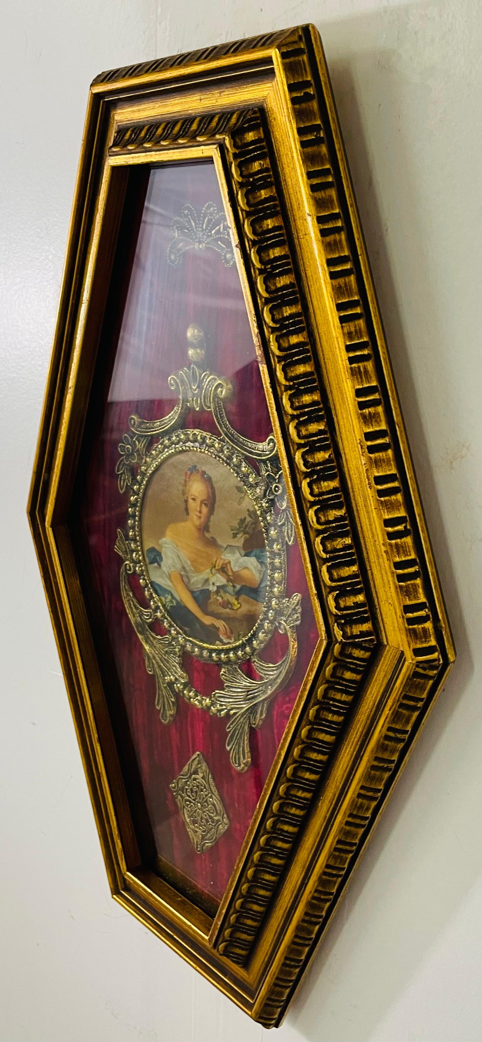 An antique French School round hand painted portrait of a lady on canvas presented in a very elegant plaque with red velvet background. The portrait is nicely decorated with brass floral and acanthus design ornaments framing the portrait and