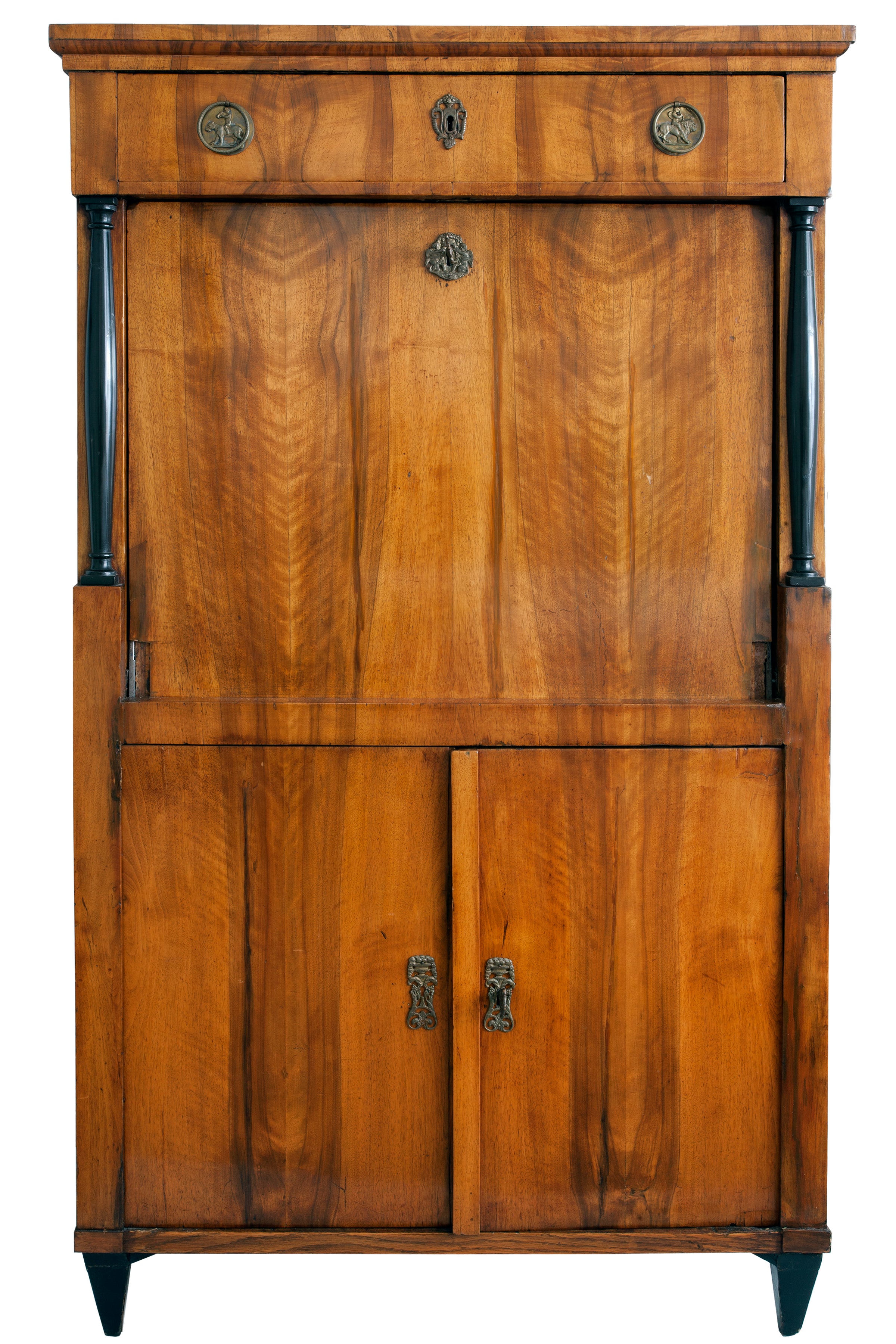 This early 19th-century drop-leaf secretaire features the traditional Biedermeier ebony accents, columns, and matched woodgrain pattern. Unlike the high gloss finish of many pieces from this period, the wood has a less formal soft-matte patina, with