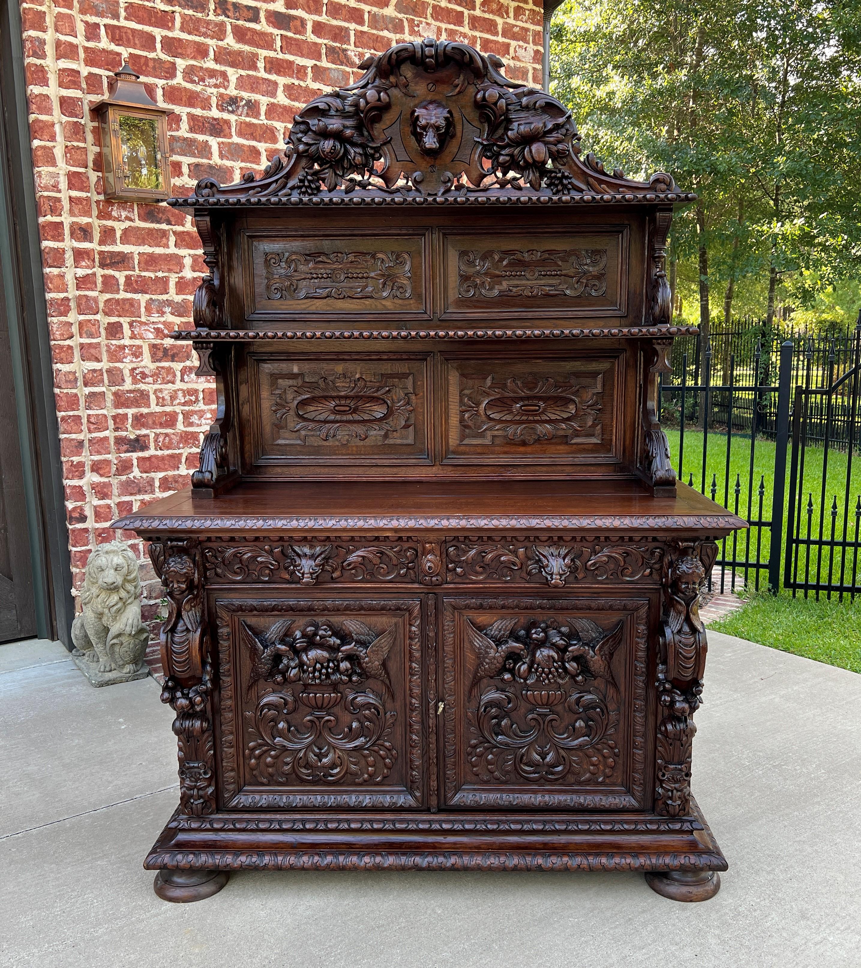 Superb 19th century antique french oak 3-tier black forest server sideboard buffet cabinet~~lion mask and love birds~~
c. 1880s 

This is only one of multiple exquisite pieces recently received from our European shipper~~wonderful hand-carved oak