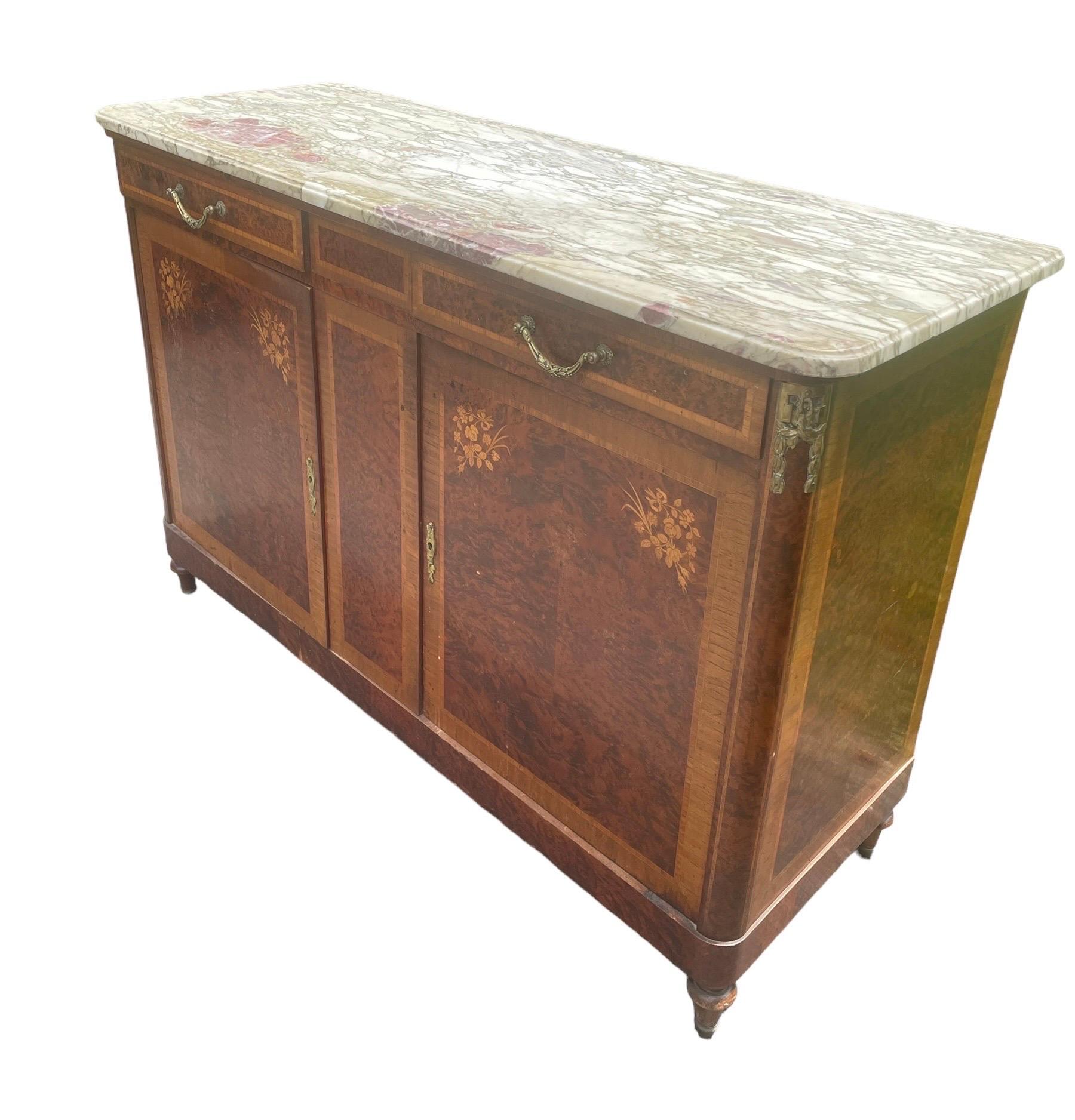 French burl wood, walnut and inlaid marble top server with bronze mounts, circa 1920. This beauty is 6 feet long with one of the most gorgeous marble top veining I’ve ever seen.

Ht: 41.5