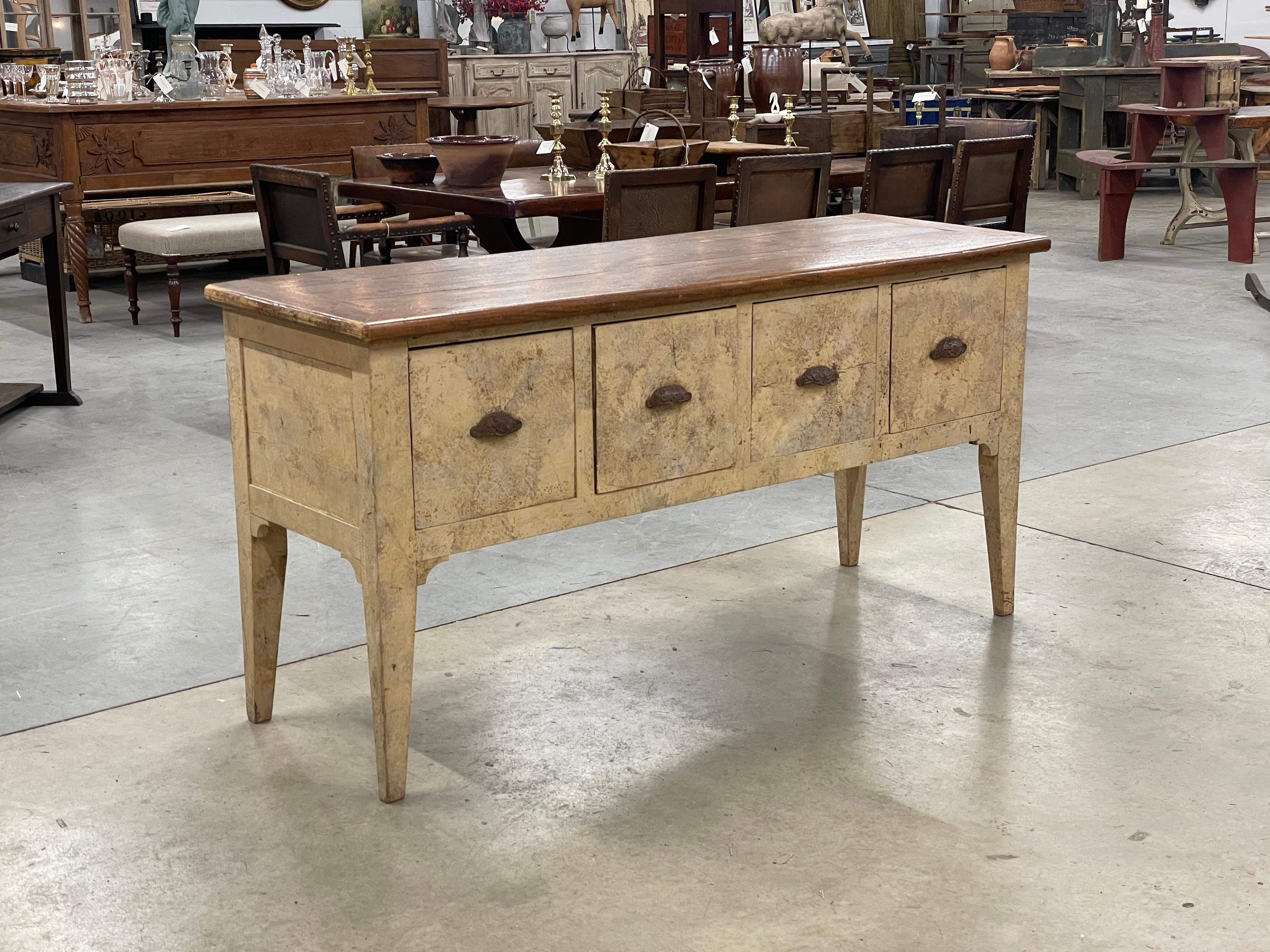 Antique French painted serving table with 4 deep dovetailed drawers. The unadorned  top sits on 4 simple slightly splayed legs. 

It has a very English feel to the design and possibly travelled across the Channel to Northern France where it was