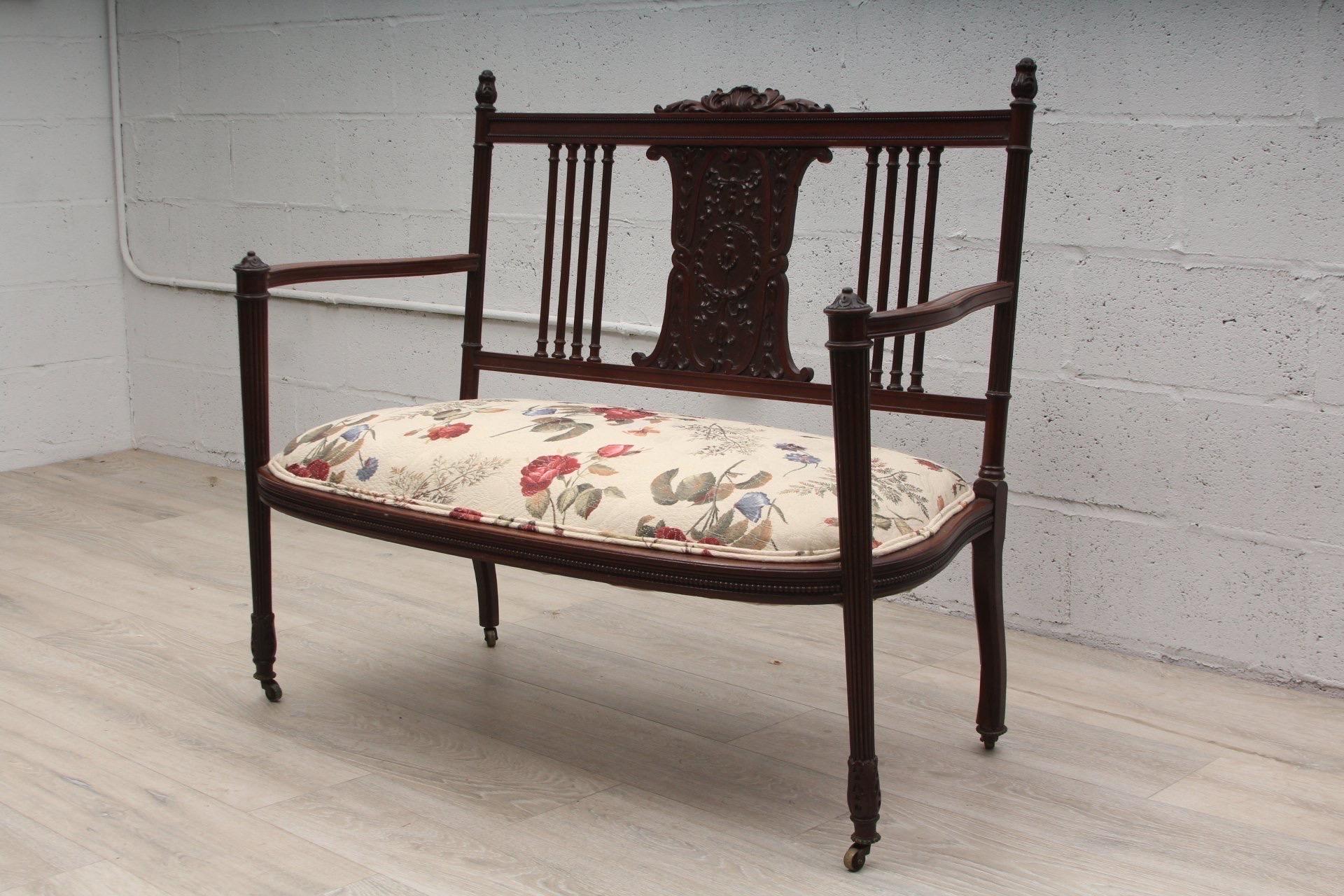 Antique carved fruitwood settee with upholstered seat.

French, circa 1910 with later upholstery.

Dimensions: 42.5”L x 24”W x 35.5”H
Arm Height- 17”
Seat Height- 25.5”