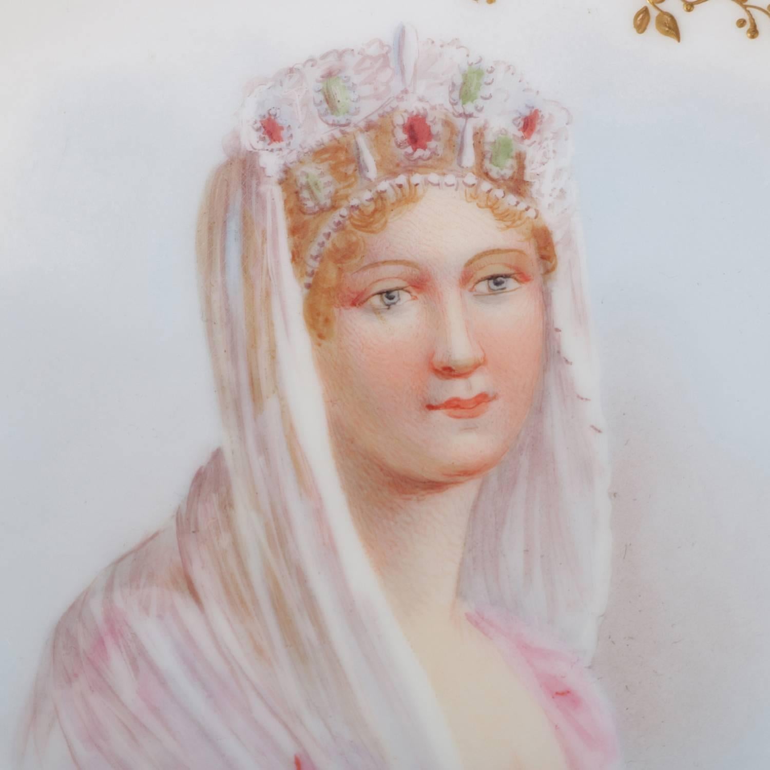 Antique French Sevres porcelain hand-painted porcelain portrait plate features central portrait of crowned princess artist signed lower right, scalloped border with floral reserves and gilt foliate and scroll accents, en verso with 
