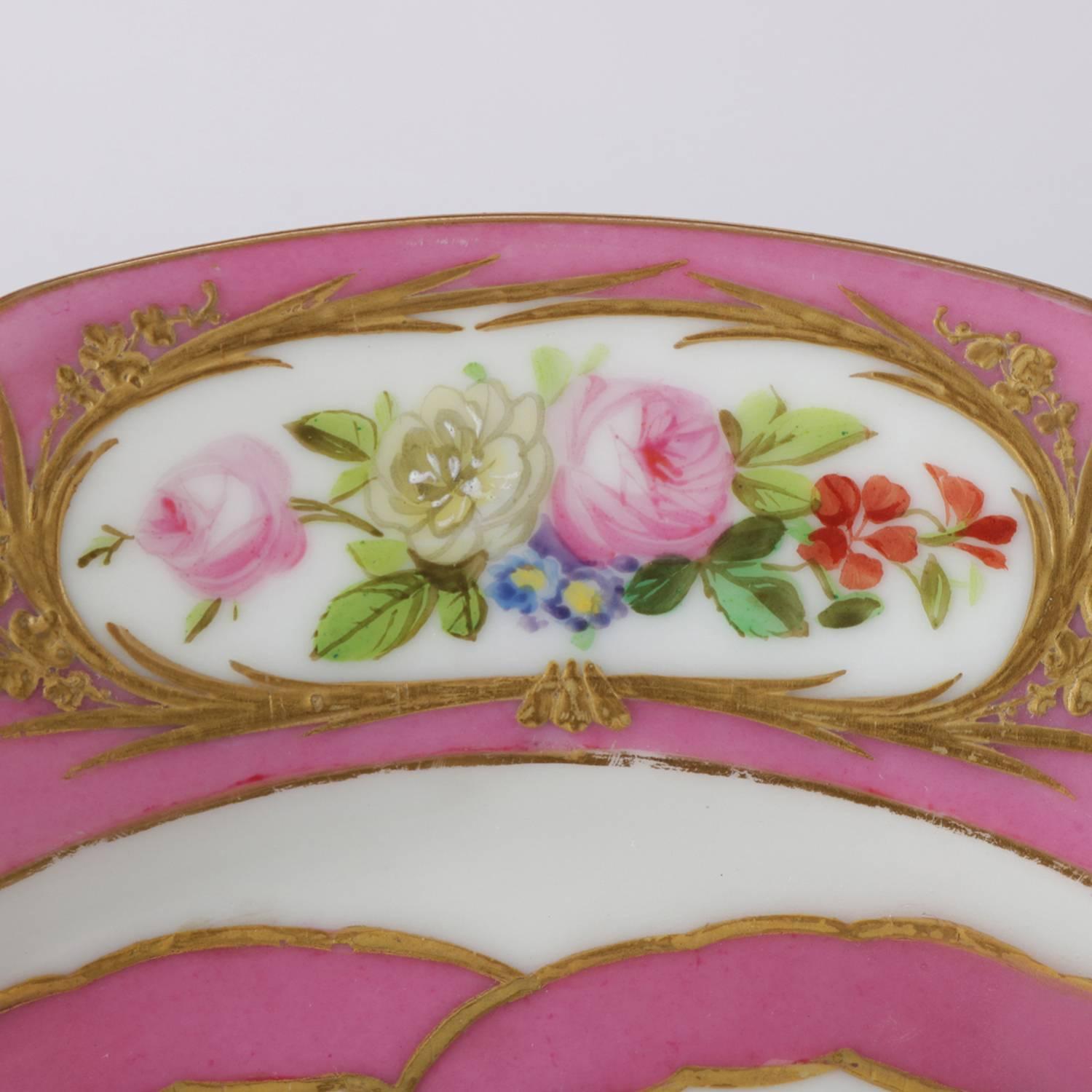 Antique French Sevres porcelain hand-painted porcelain portrait plate features central portrait, scalloped border with floral reserves and gilt accents, en verso with Sevres double 