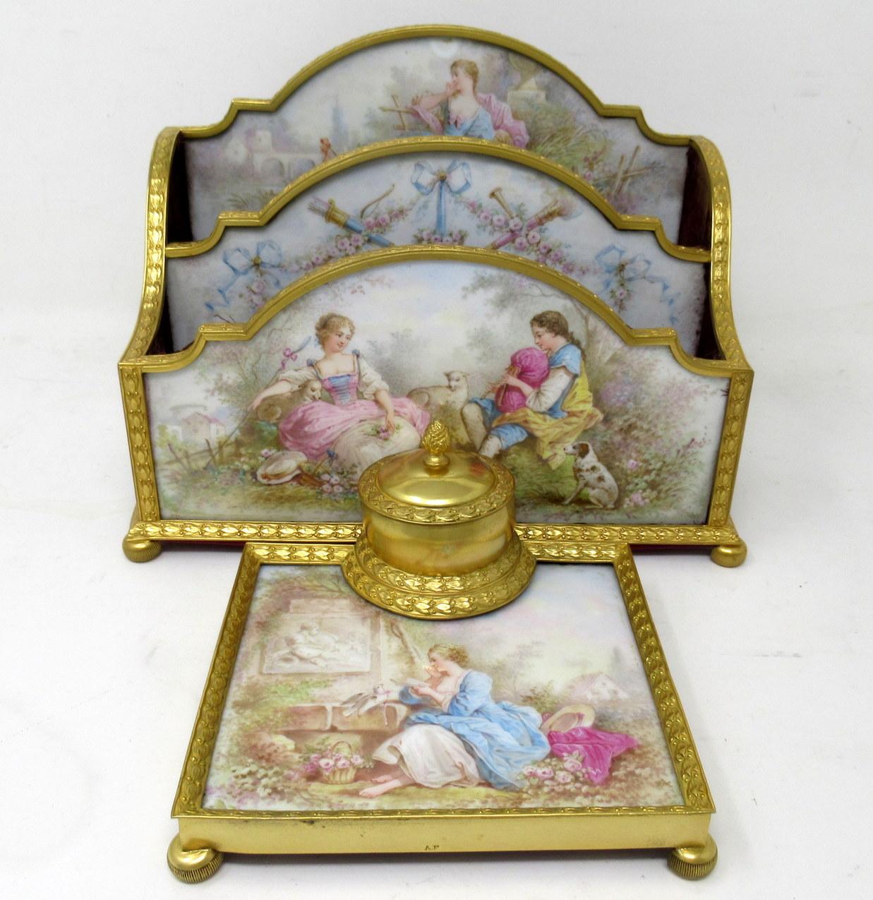 An exceptionally well cast French Sevres soft paste porcelain and Gilt-Bronze Ormolu Desk Letters Holder, complete with its matching single Inkwell of similar design. Third quarter of the Nineteenth Century.  

The holder made of five hand painted